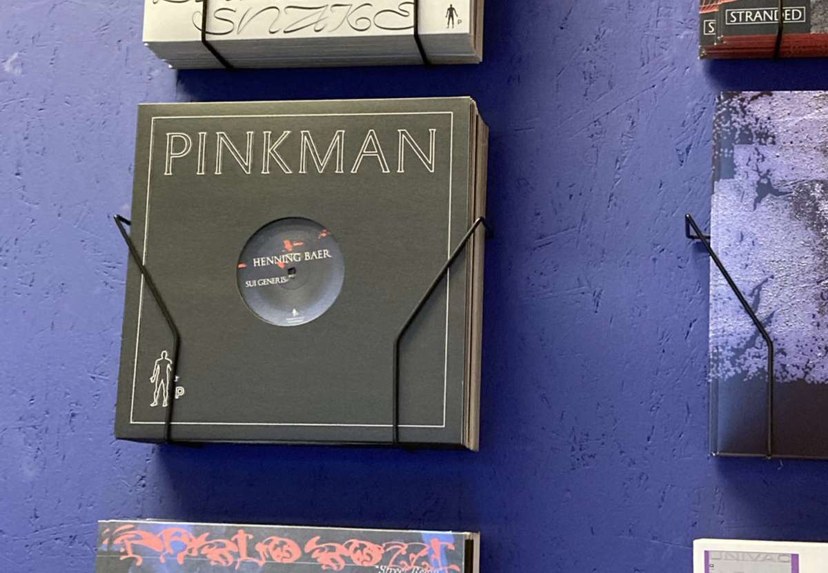 Pinkman record sleeve displayed on a blue wall