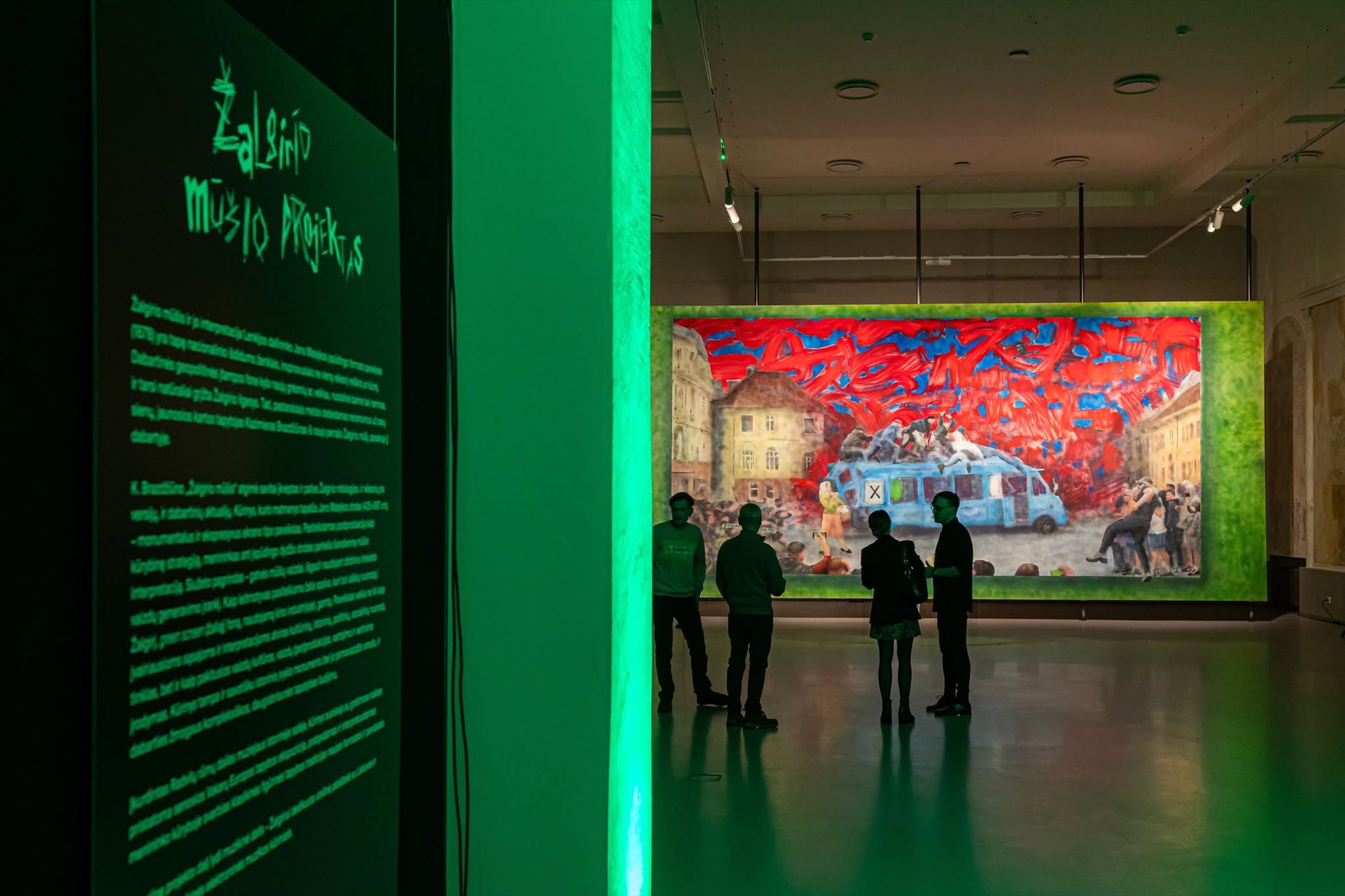 Žalgiris Battle Project exhibition room with green light and a large painting