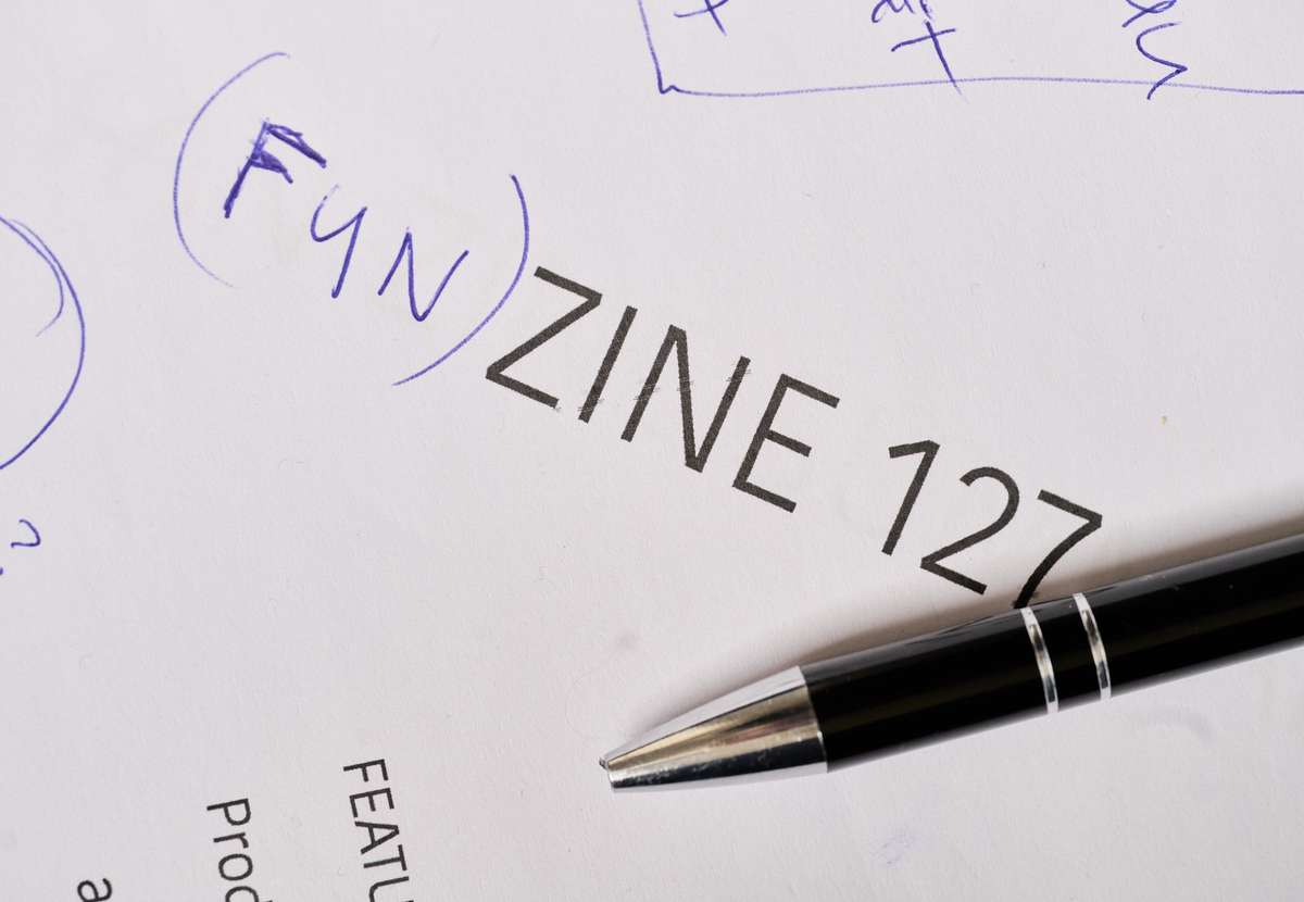 Whiteboard with the zine’s working title, (Fun)zine 127