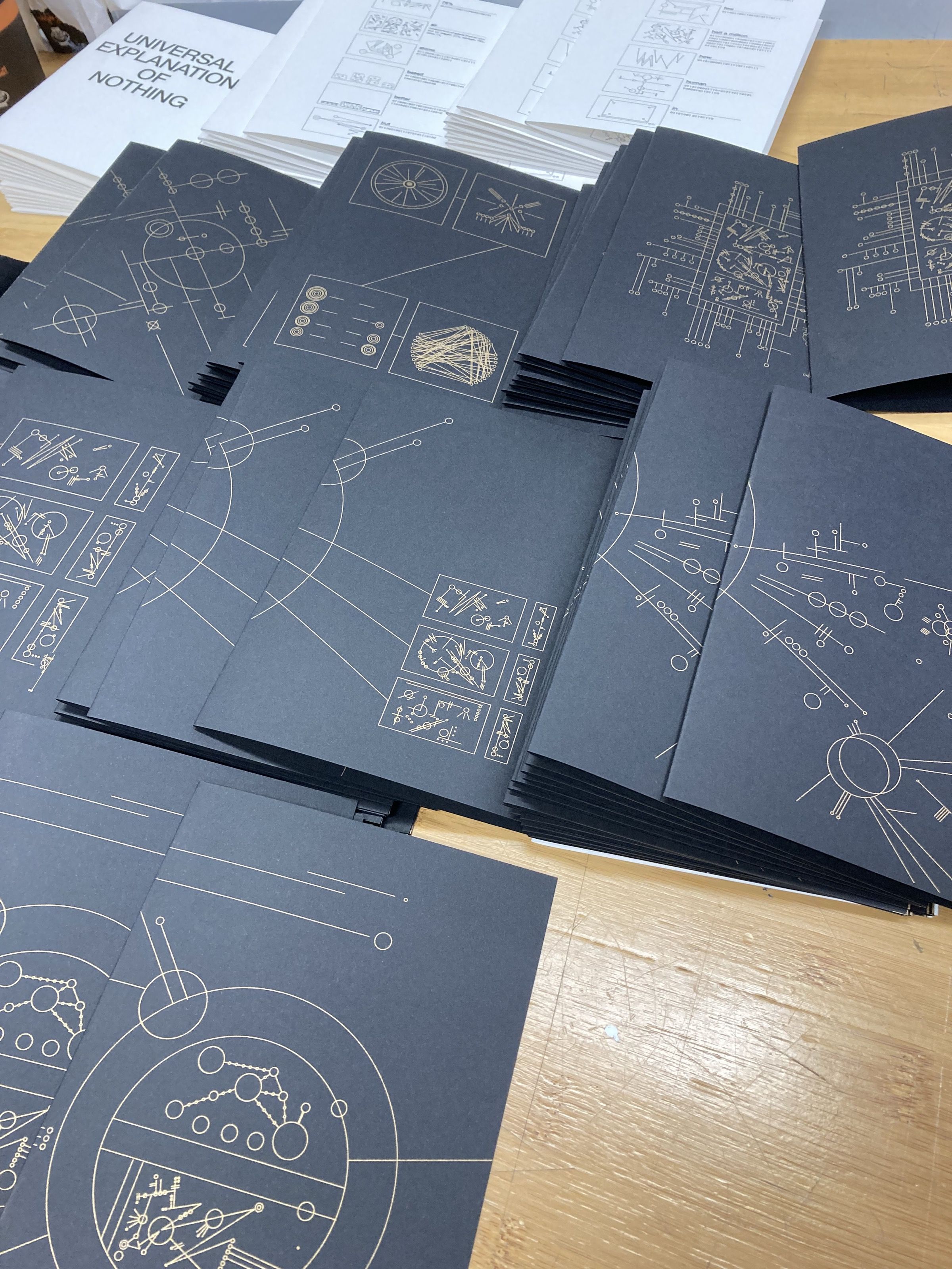Black pages with gold diagrams from Universal Explanation of Nothing