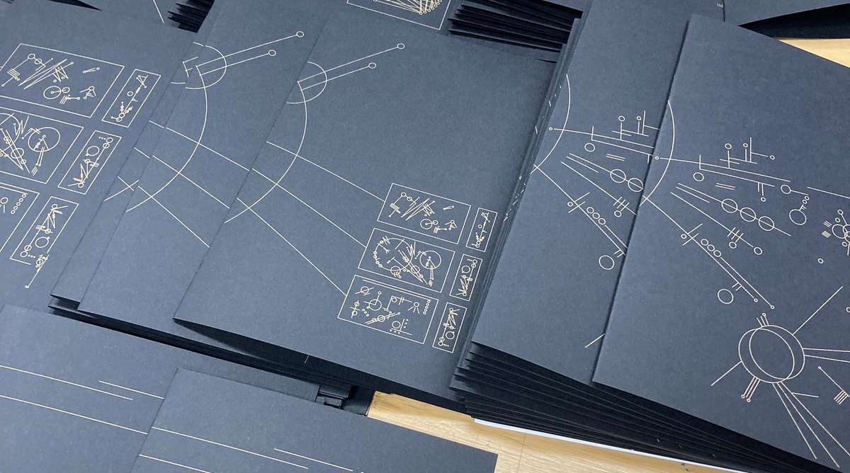Black pages with gold diagrams from Universal Explanation of Nothing