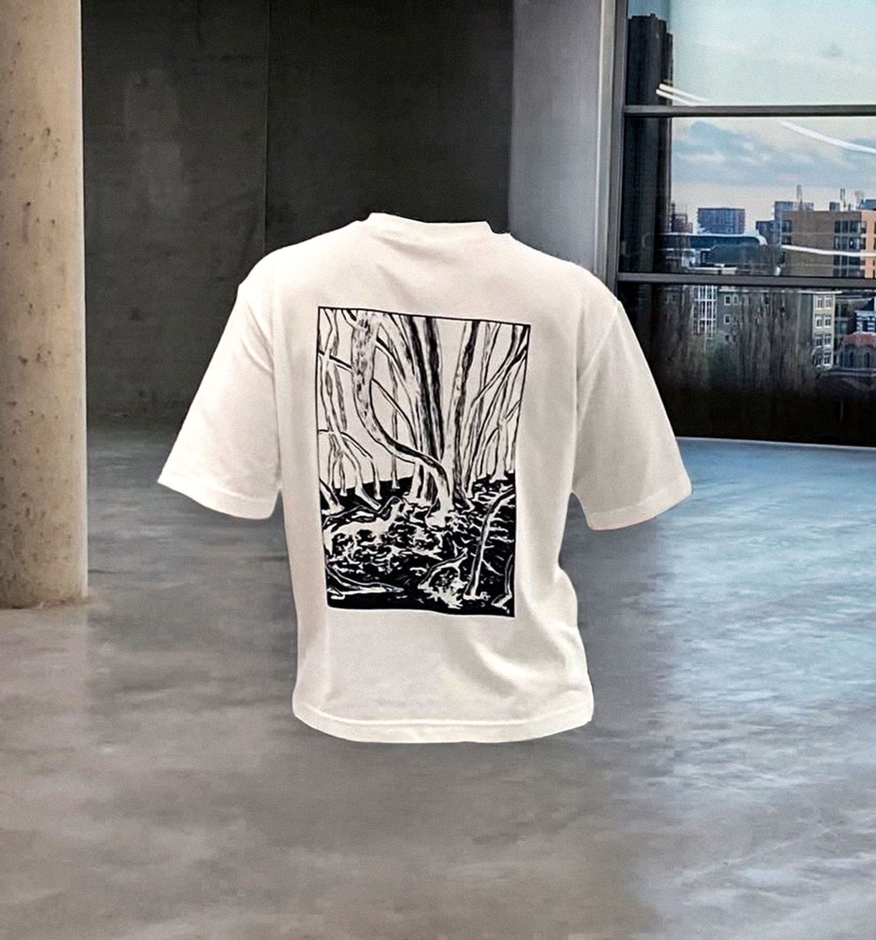 White T-shirt with a black-and-white forest print on the back