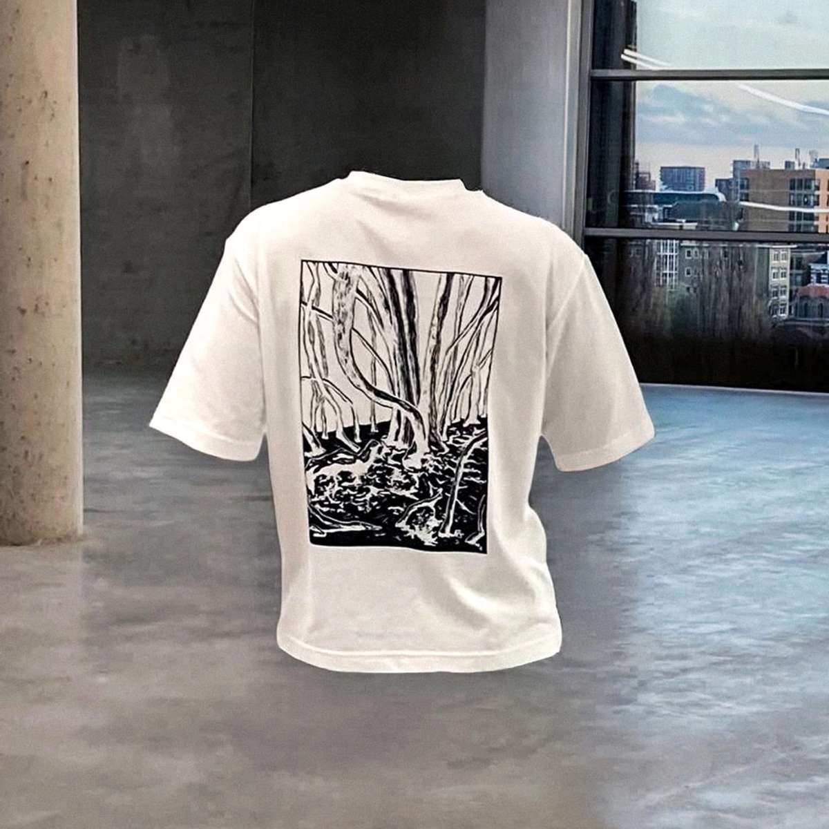 White T-shirt with a black-and-white forest print on the back