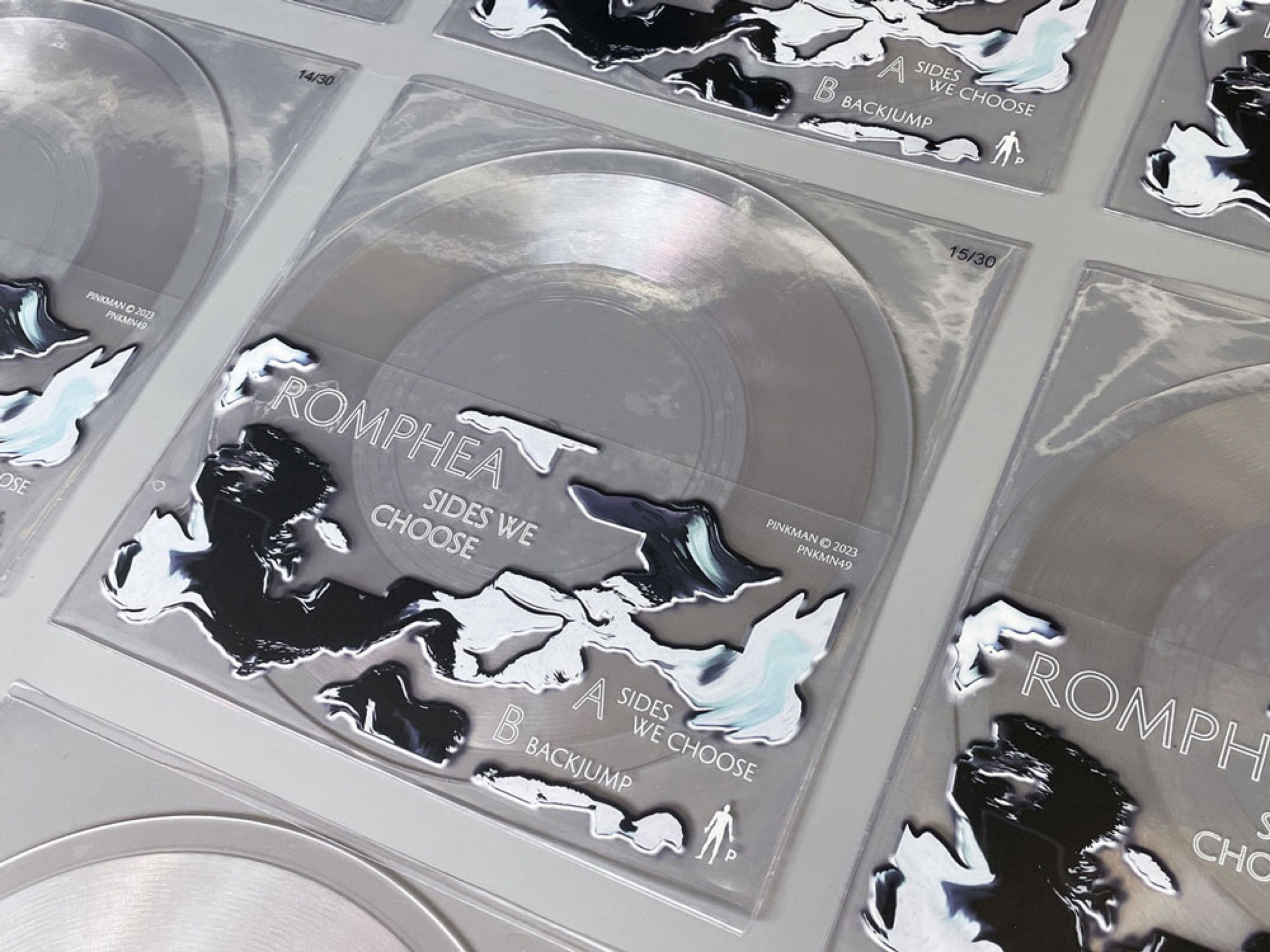 Clear vinyl sleeves for Romphea with black and white liquid print