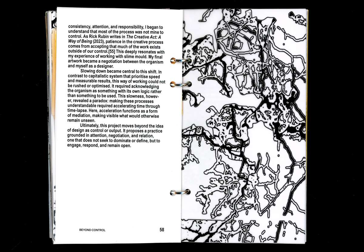 Book spread with text beside a large black slime-mould network drawing
