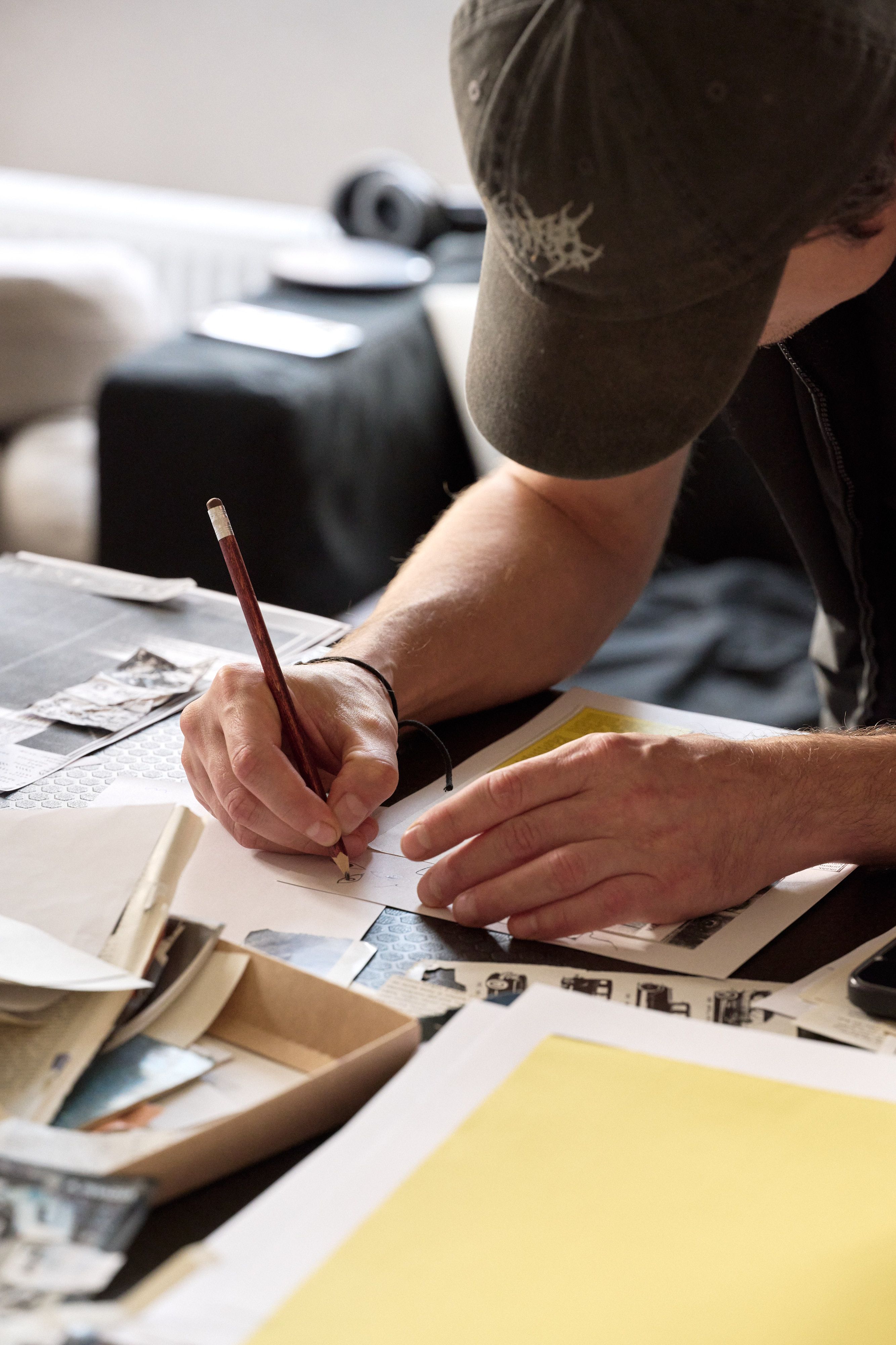 A participant drawing a zine spread by hand