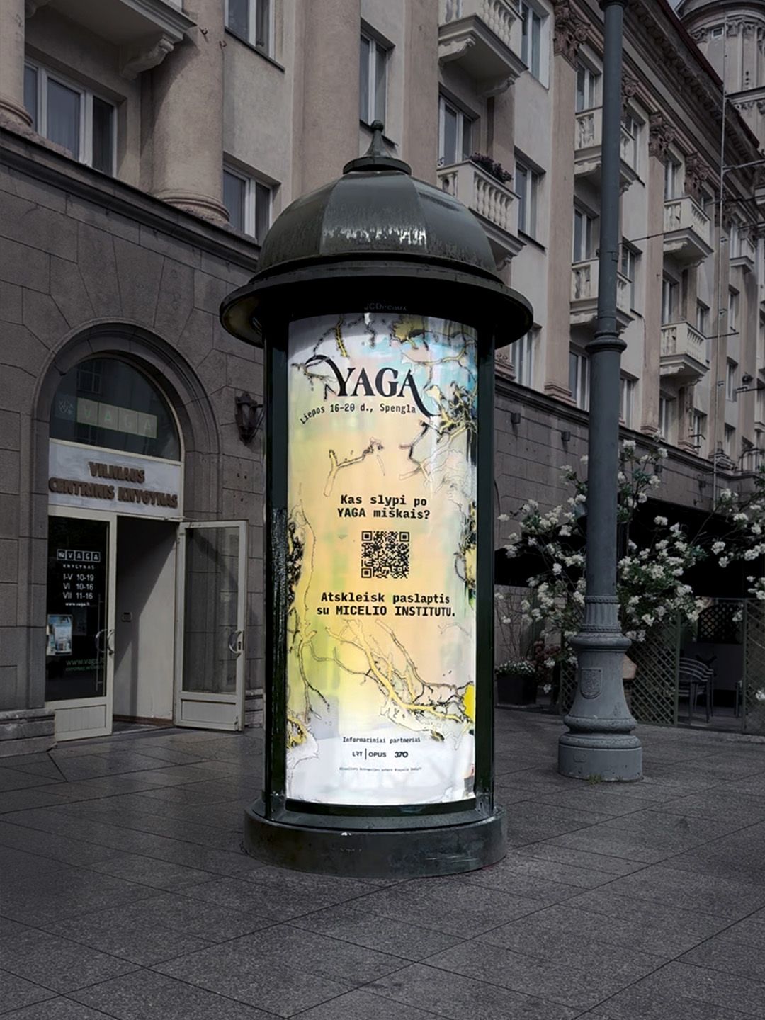 YAGA Gathering poster on an advertising column on a Vilnius street