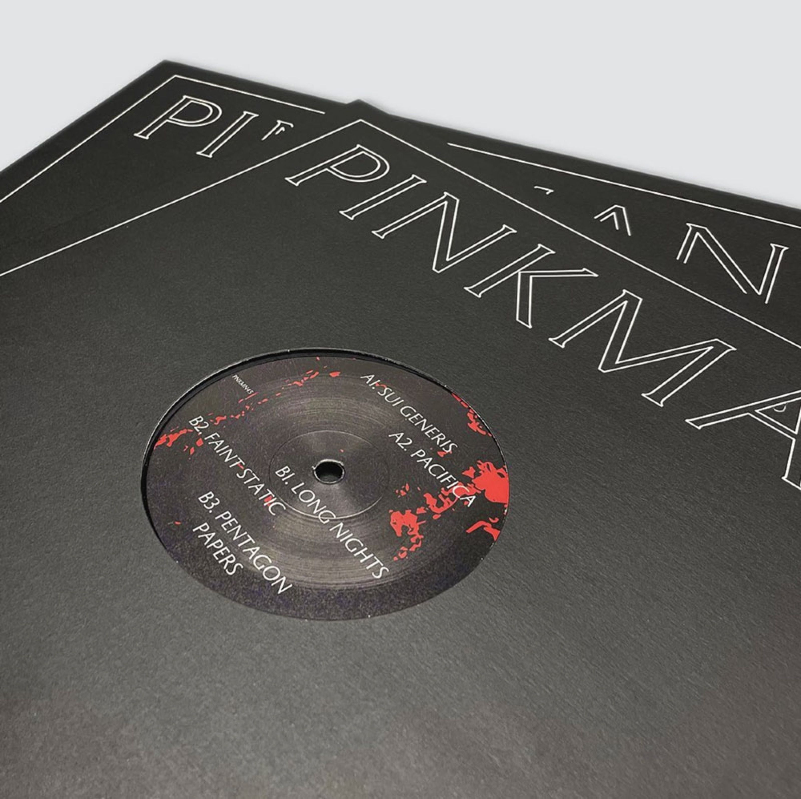 Black Pinkman record sleeve with embossed outline lettering and a vinyl label