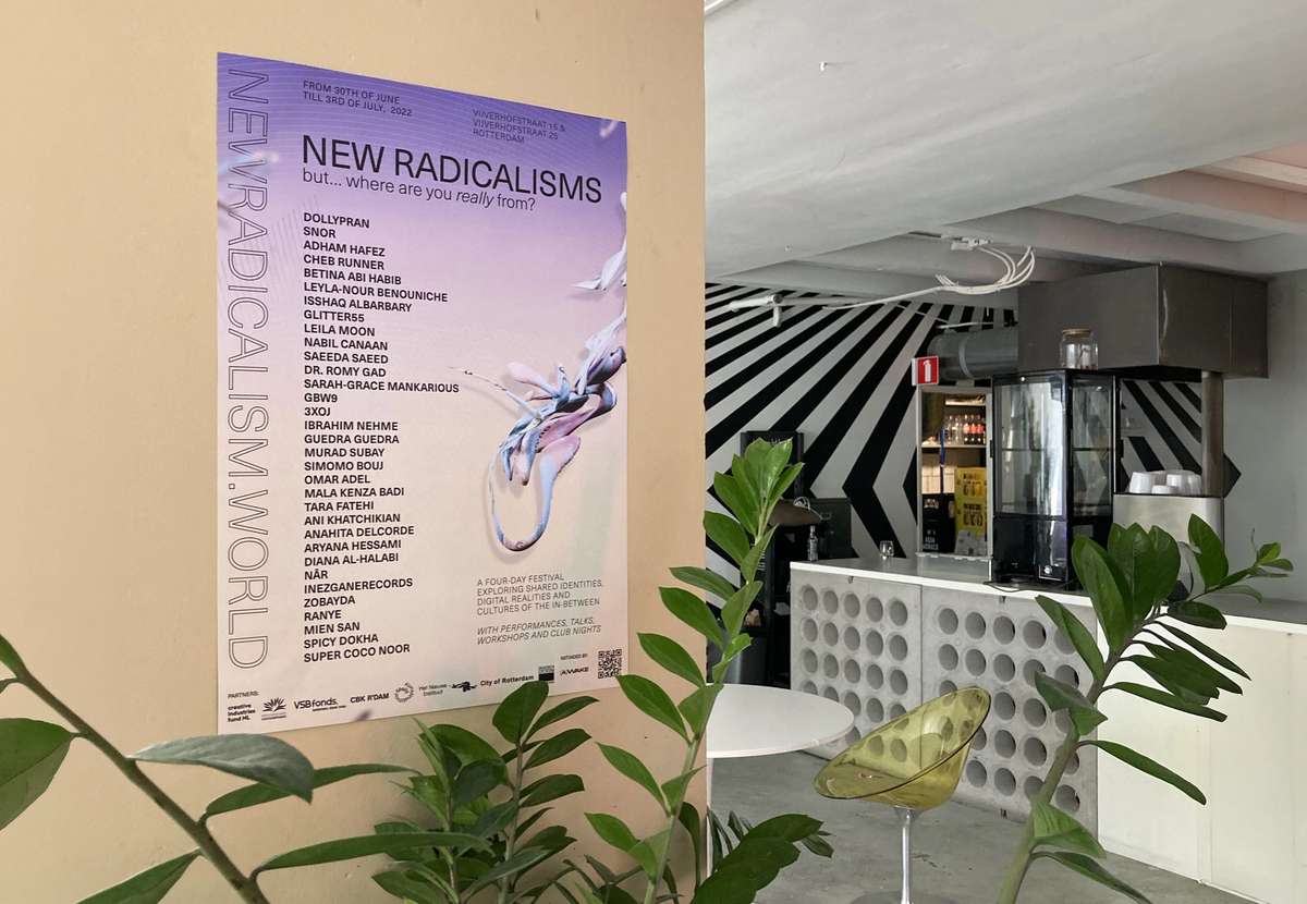New Radicalisms lineup poster on a pillar beside a plant