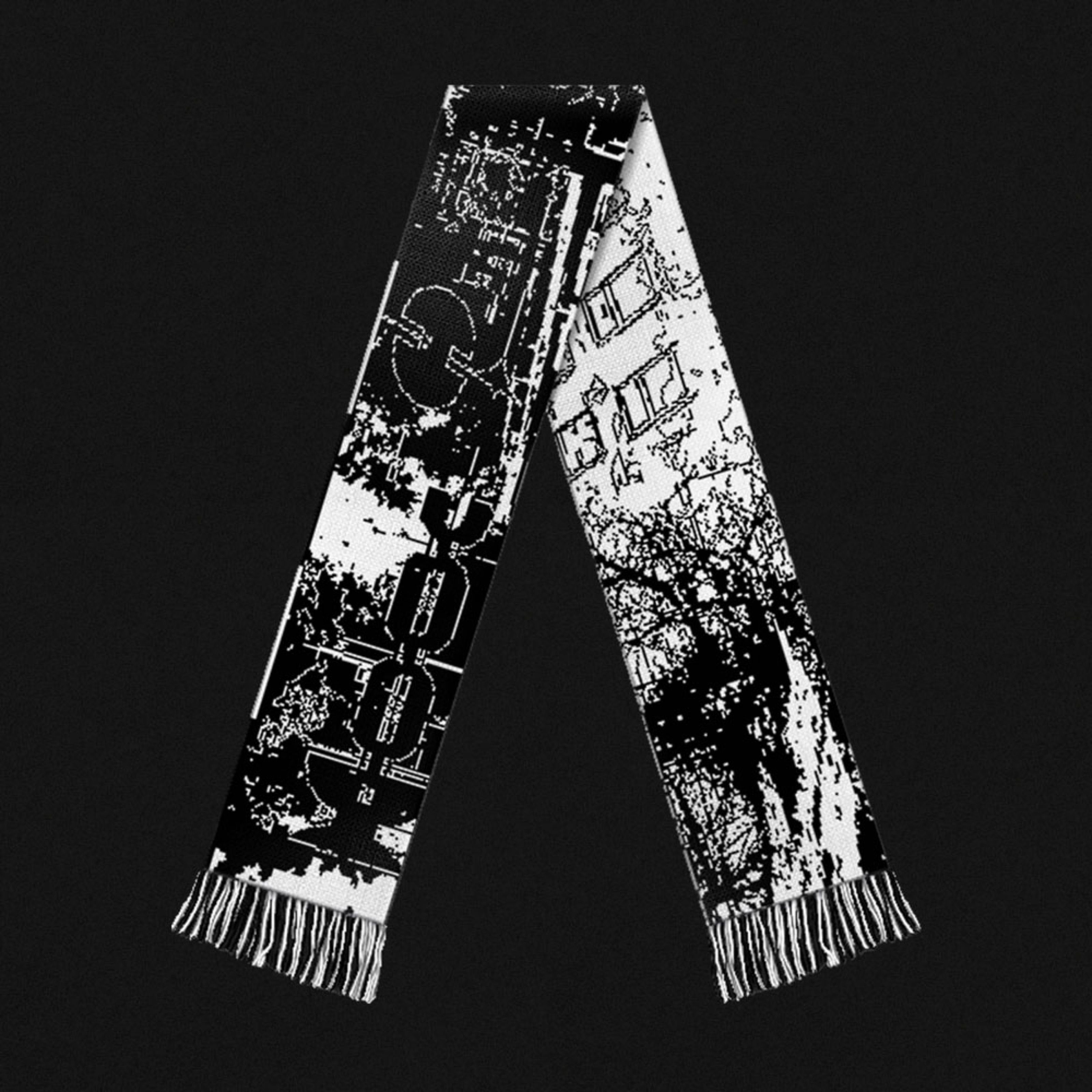 Black-and-white jacquard scarf with forest and graphic patterns