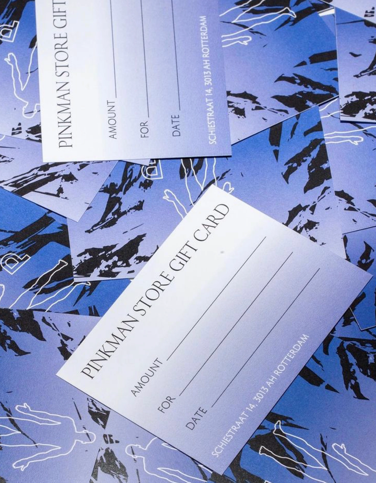 Pinkman Store gift cards on a blue patterned background