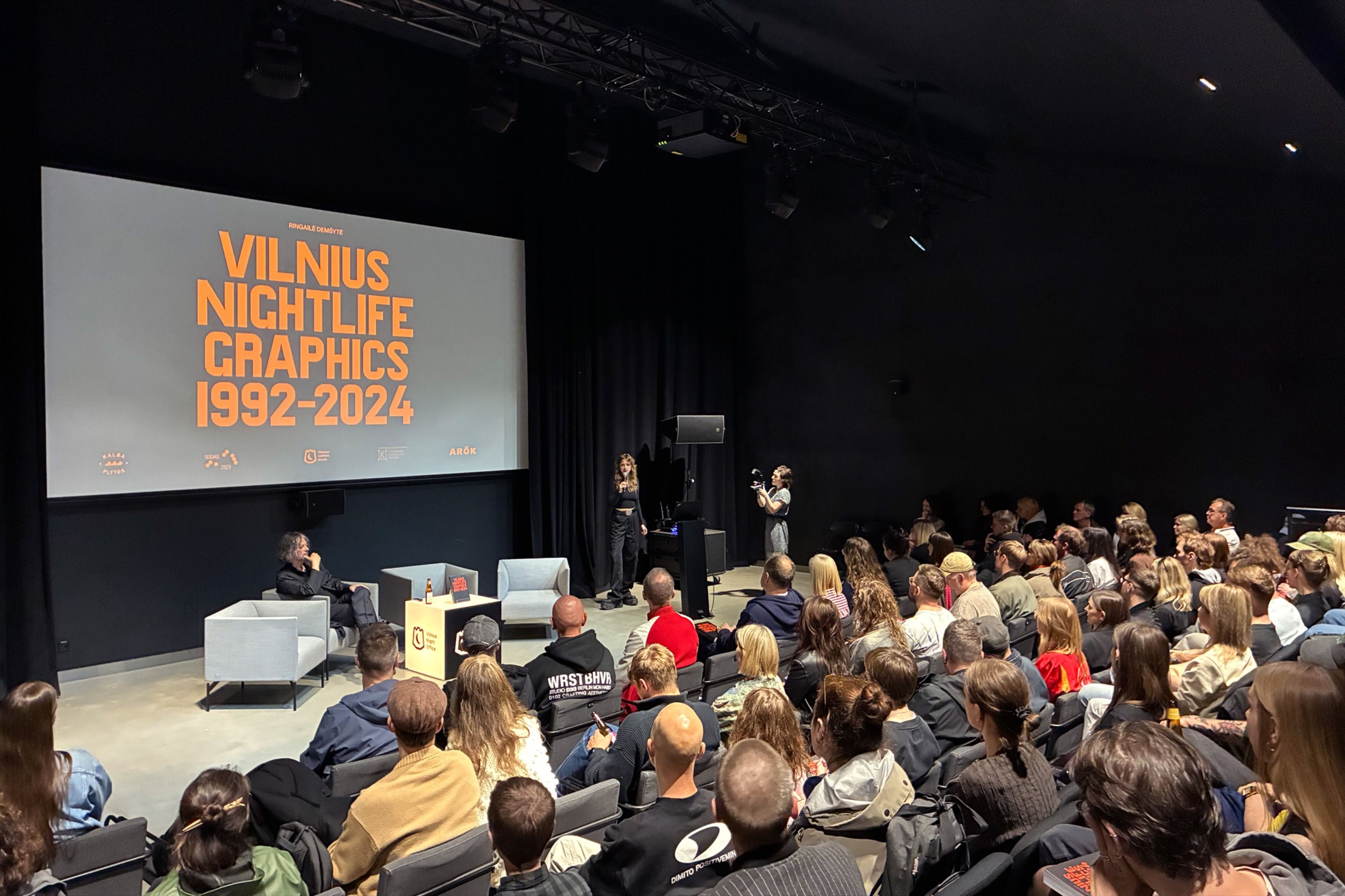 Full auditorium at the Vilnius Nightlife Graphics 1992–2024 book launch