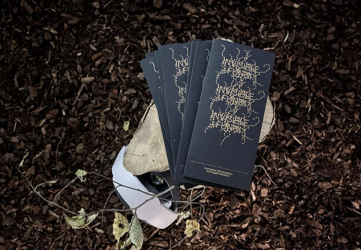 Invisible Fungi booklets lying on wood chips