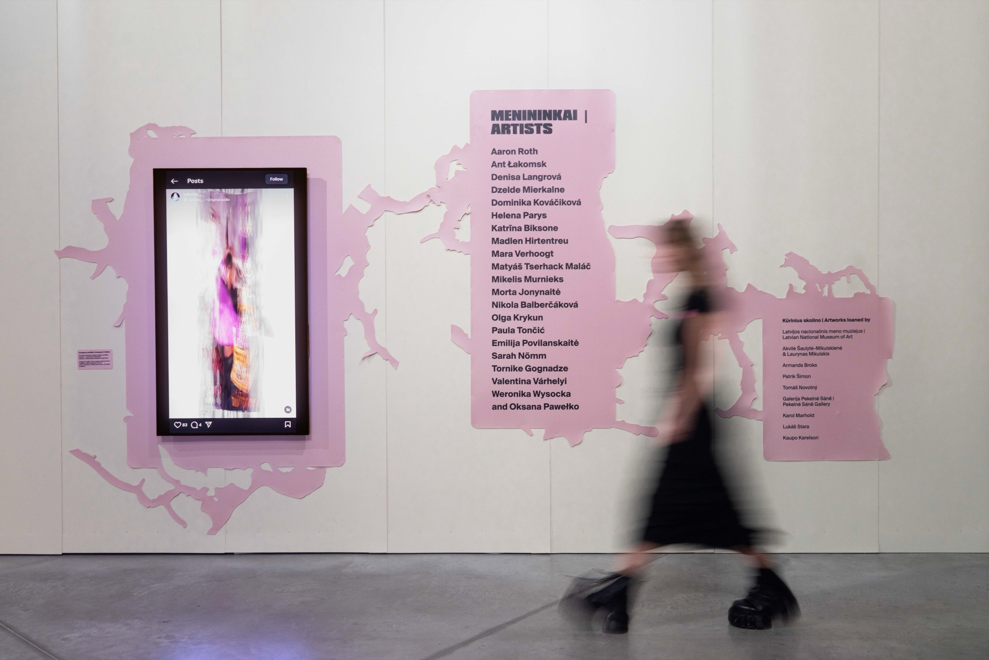 Gen Z. All at Once exhibition wall with pink graphics and artist list, MO Museum