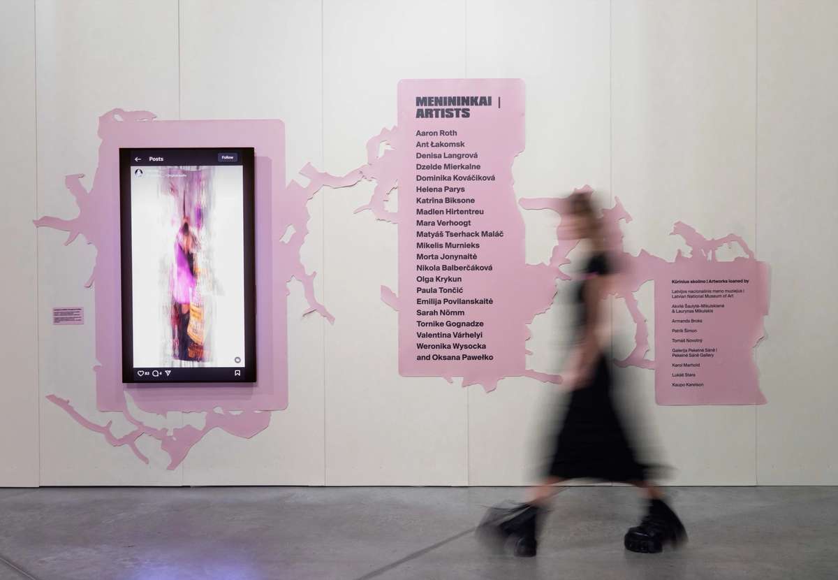 Gen Z. All at Once exhibition wall with pink graphics and artist list, MO Museum