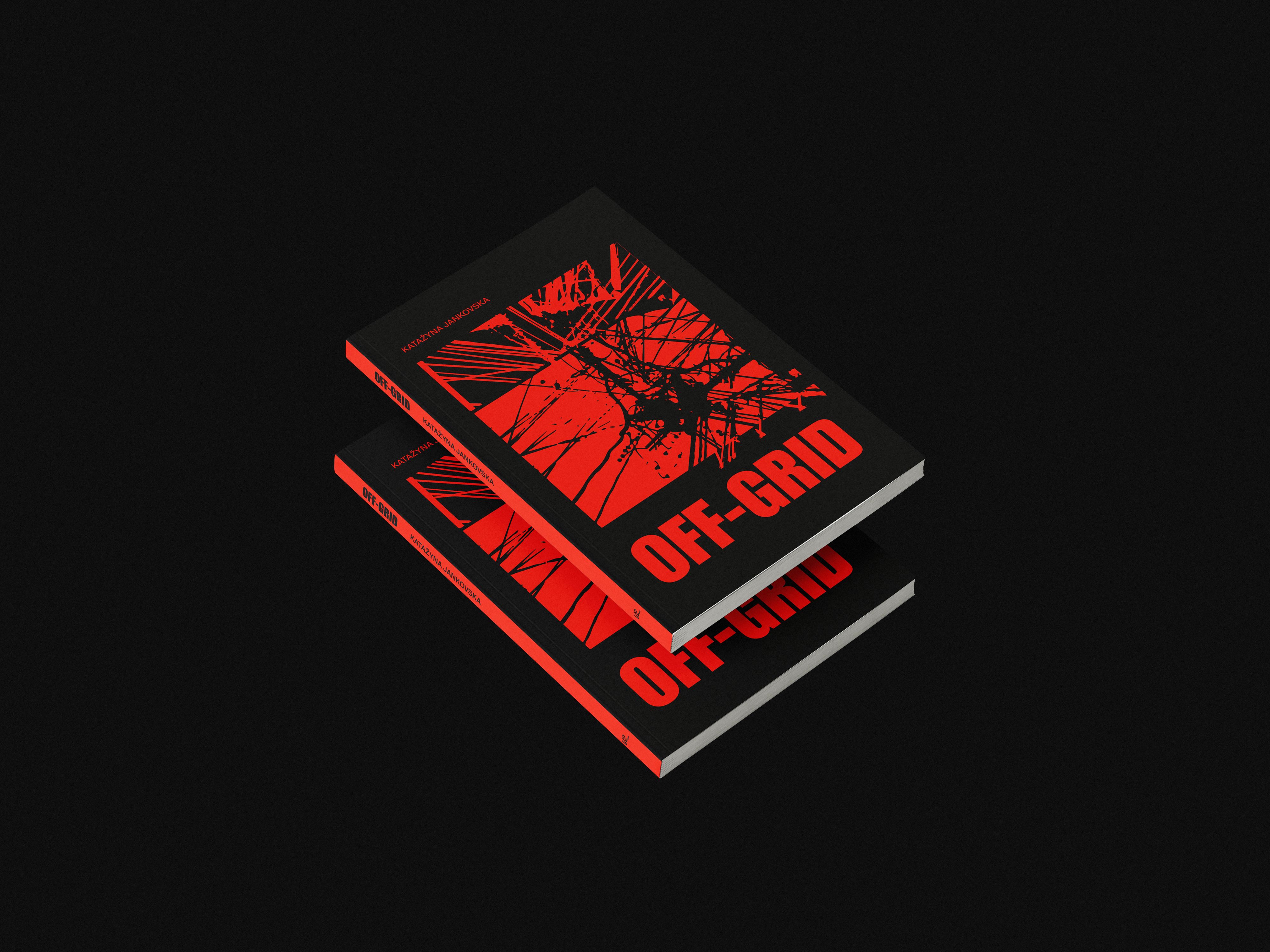 Two copies of the OFF-GRID book with red and black covers on a black background