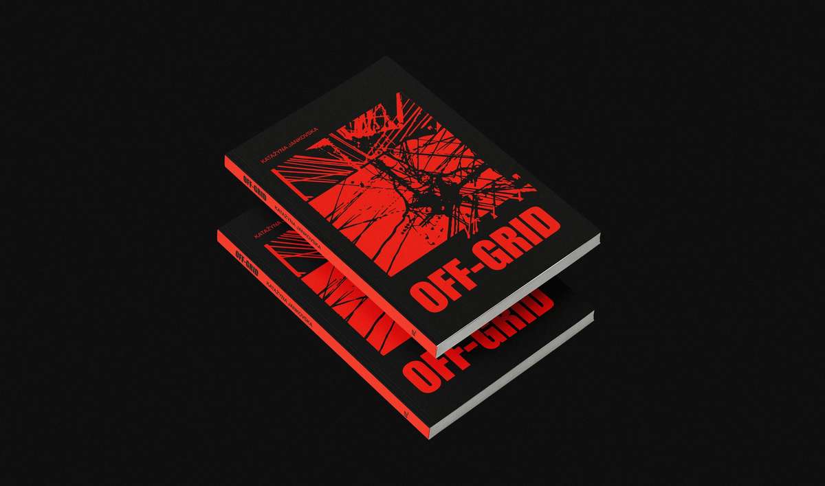 Two copies of the OFF-GRID book with red and black covers on a black background
