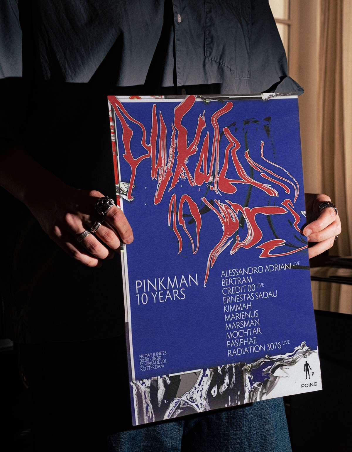 Person holding the Pinkman 10 Years poster