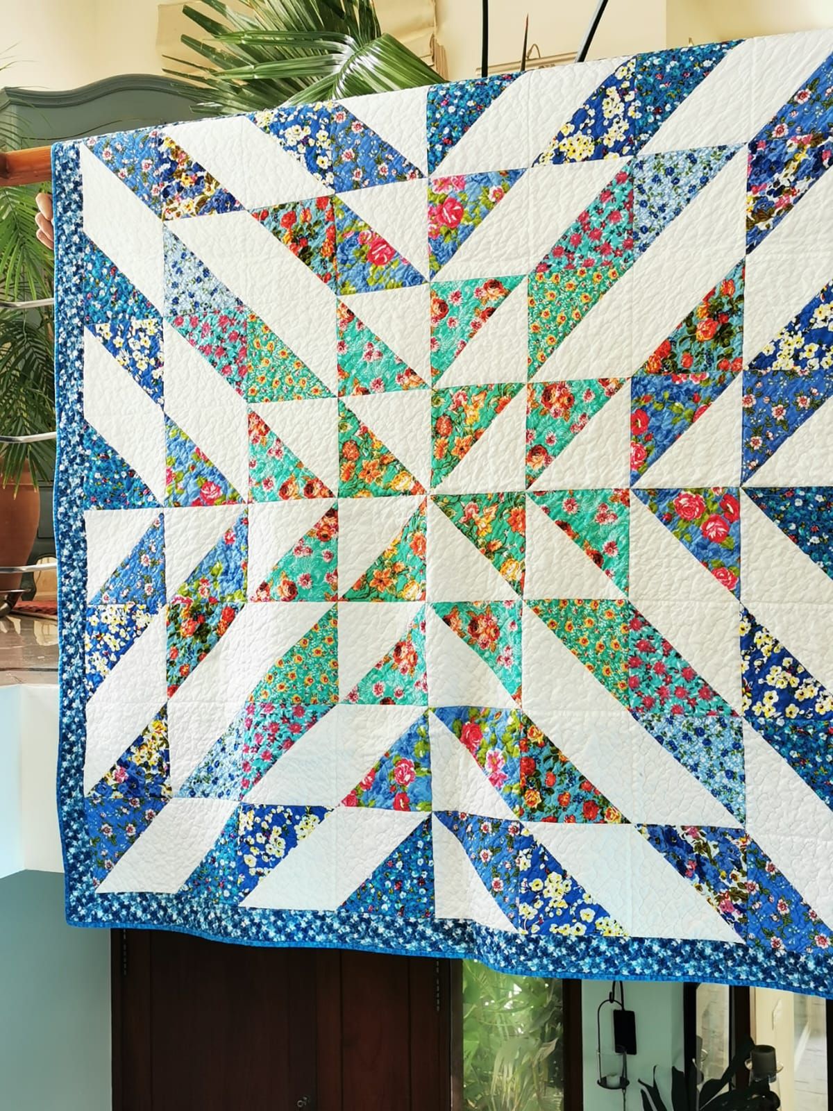 Radiant star lap quilt hung flat, a closer view of the star point