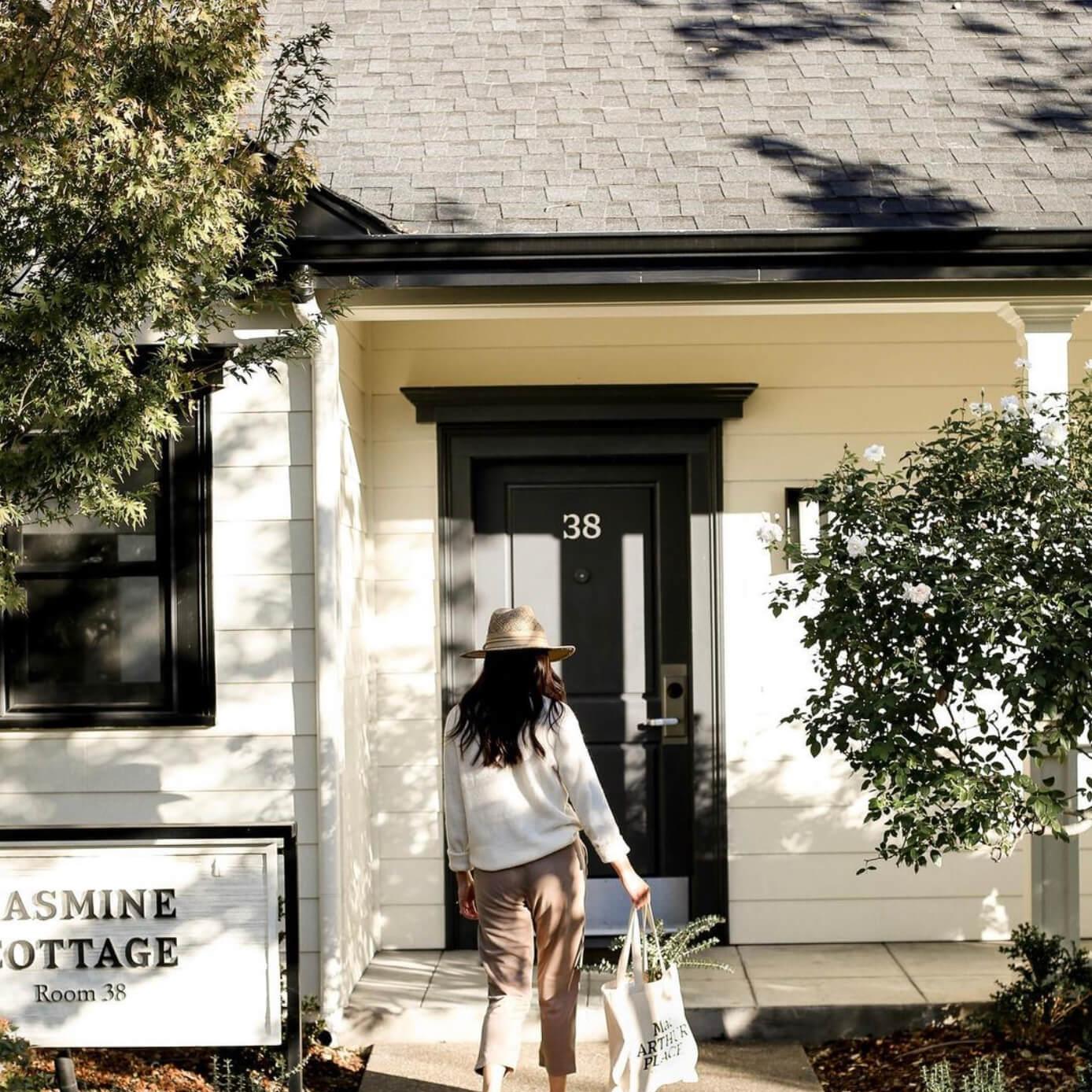 Guest arrival at MacArthur Place Hotel & Spa, a luxury boutique hotel in Sonoma, California, showing one of the property’s individual cottage accommodations and landscaped grounds. Love & War developed the brand strategy, visual identity and guest experience for MacArthur Place, extending the hospitality brand across signage, guest materials, amenities and touchpoints throughout the property to create a relaxed expression of natural luxury rooted in Sonoma Wine Country.