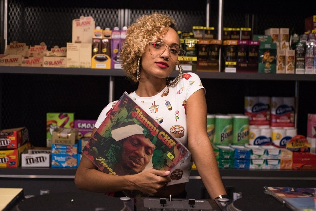 Guest inside 1-800-Lucky in Wynwood, Miami, surrounded by colorful food hall graphics and retail displays.