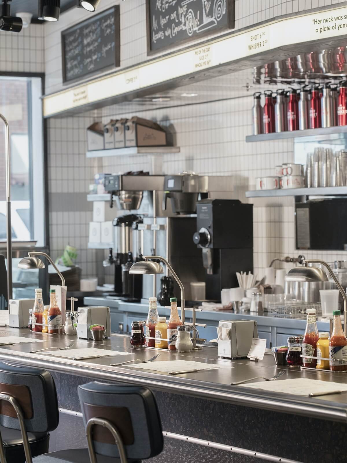 The Grey Market lunch counter in Savannah, GA, reflecting the restaurant brand and experience developed by Love & War.