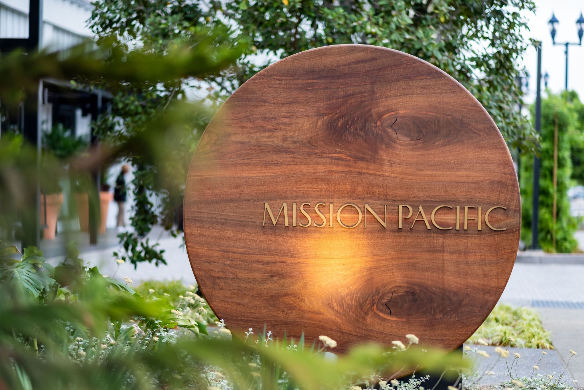 Custom Mission Pacific hotel signage in Oceanside, California, featuring natural wood and understated typography inspired by the Southern California coastal setting. Love & War developed the hotel’s name, visual identity, experience design, and brand applications, using natural materials and a restrained design language to express Mission Pacific’s relaxed approach to coastal luxury.