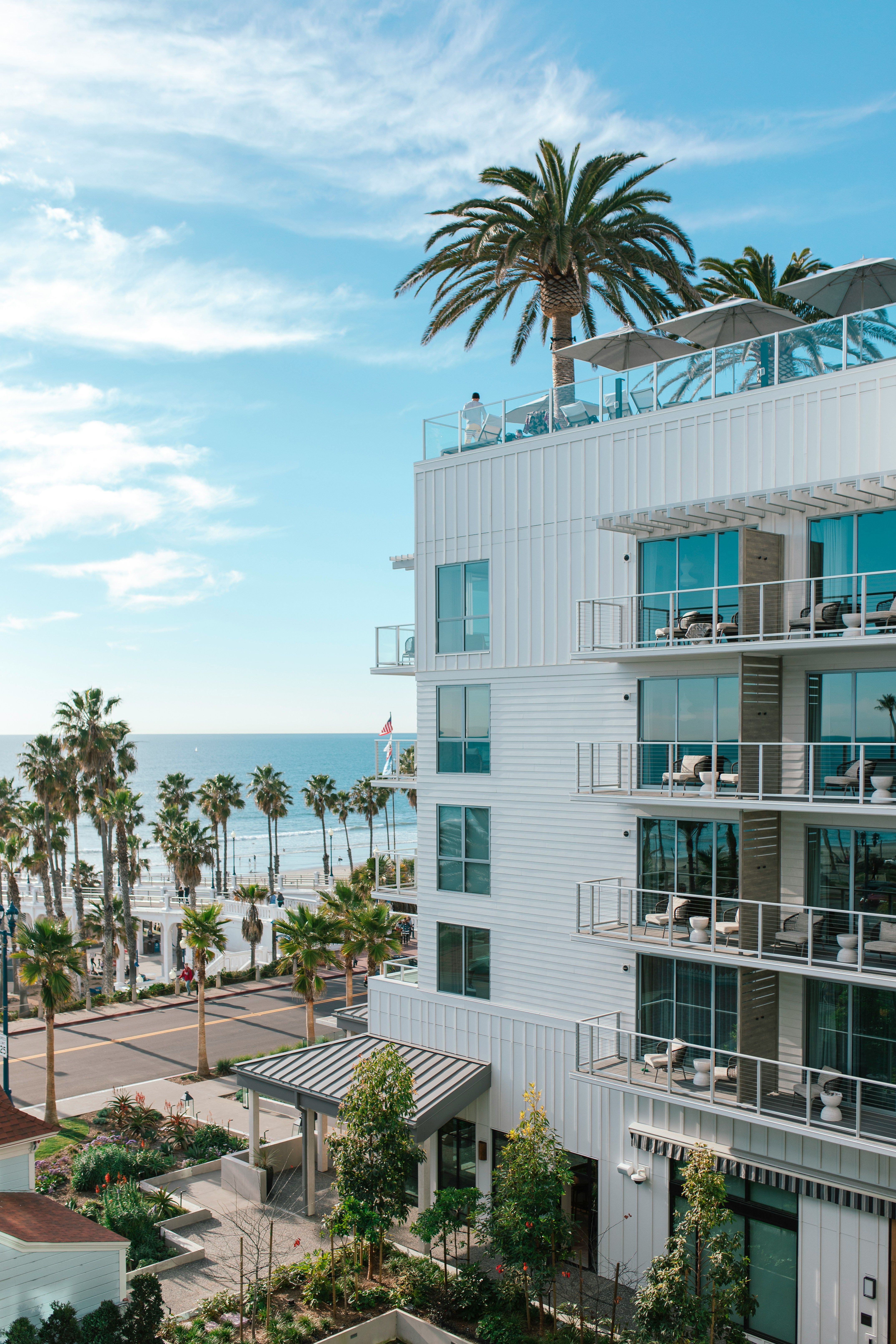 Exterior view of Mission Pacific Beach Resort in Oceanside, California, overlooking the Pacific Ocean and palm-lined beachfront. Love & War developed the hotel’s concept, naming, visual identity, experience design, and marketing, creating a hospitality brand that captures the relaxed coastal character and creative energy of Southern California.