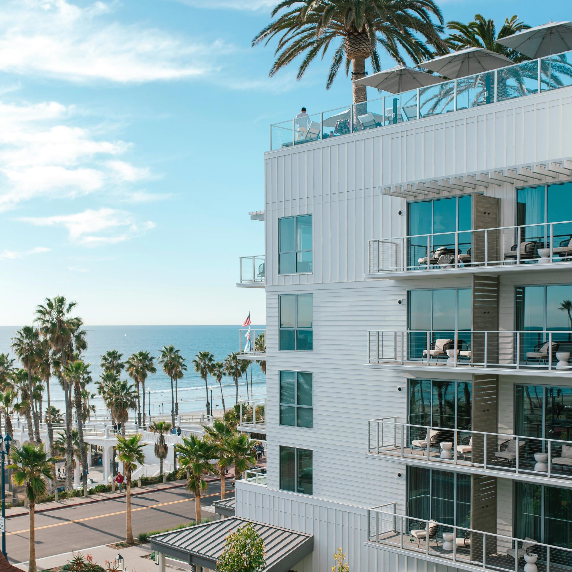 Exterior view of Mission Pacific Beach Resort in Oceanside, California, overlooking the Pacific Ocean and palm-lined beachfront. Love & War developed the hotel’s concept, naming, visual identity, experience design, and marketing, creating a hospitality brand that captures the relaxed coastal character and creative energy of Southern California.