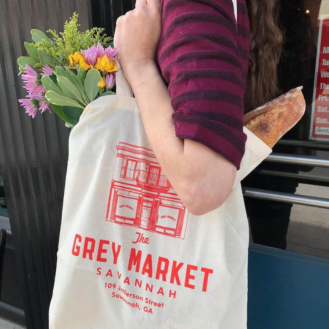 The Grey Market tote bag in Savannah, GA, featuring custom merchandise and brand identity by Love & War.
