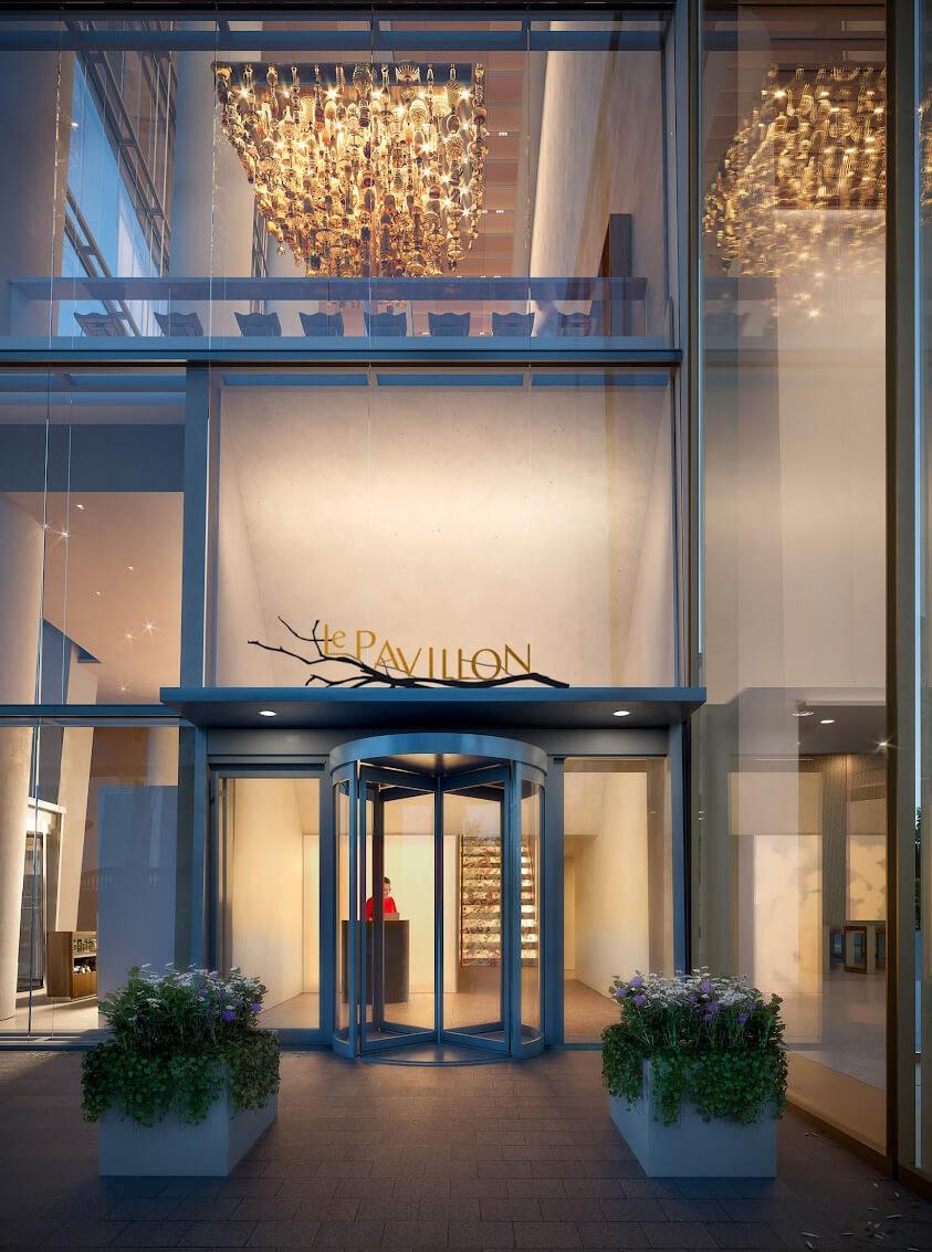 Le Pavillon entrance at One Vanderbilt in Midtown Manhattan, featuring the restaurant’s illuminated signage and street-level arrival.