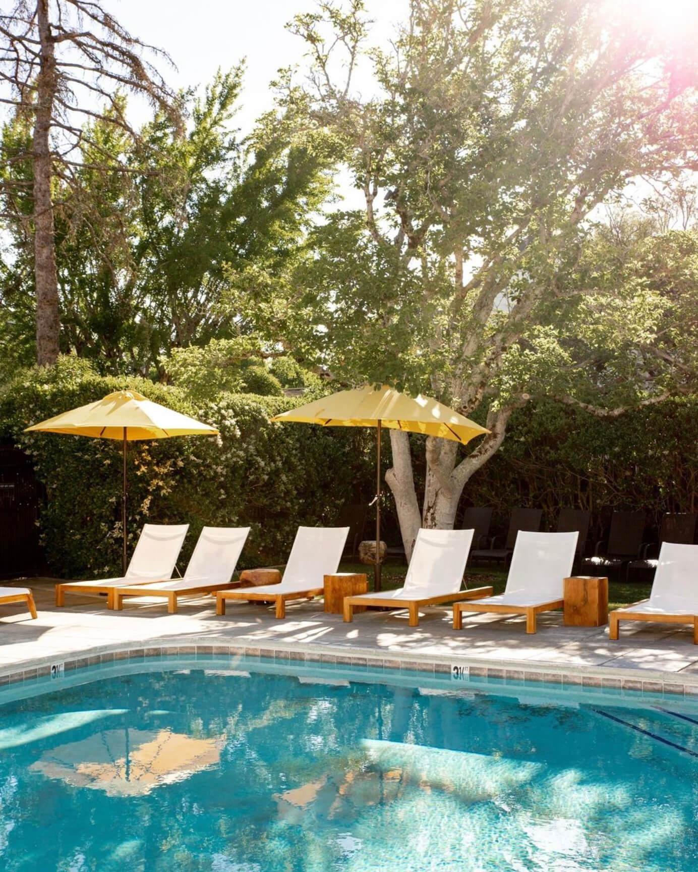 The pool at MacArthur Place Hotel & Spa, a luxury boutique hotel in Sonoma, California, surrounded by mature gardens, shaded lounge areas and the property’s relaxed Wine Country landscape. Love & War developed the brand strategy, visual identity and guest experience for MacArthur Place, repositioning the historic Sonoma hotel around natural luxury, wellness and an authentic connection to Northern California and Sonoma Wine Country.
