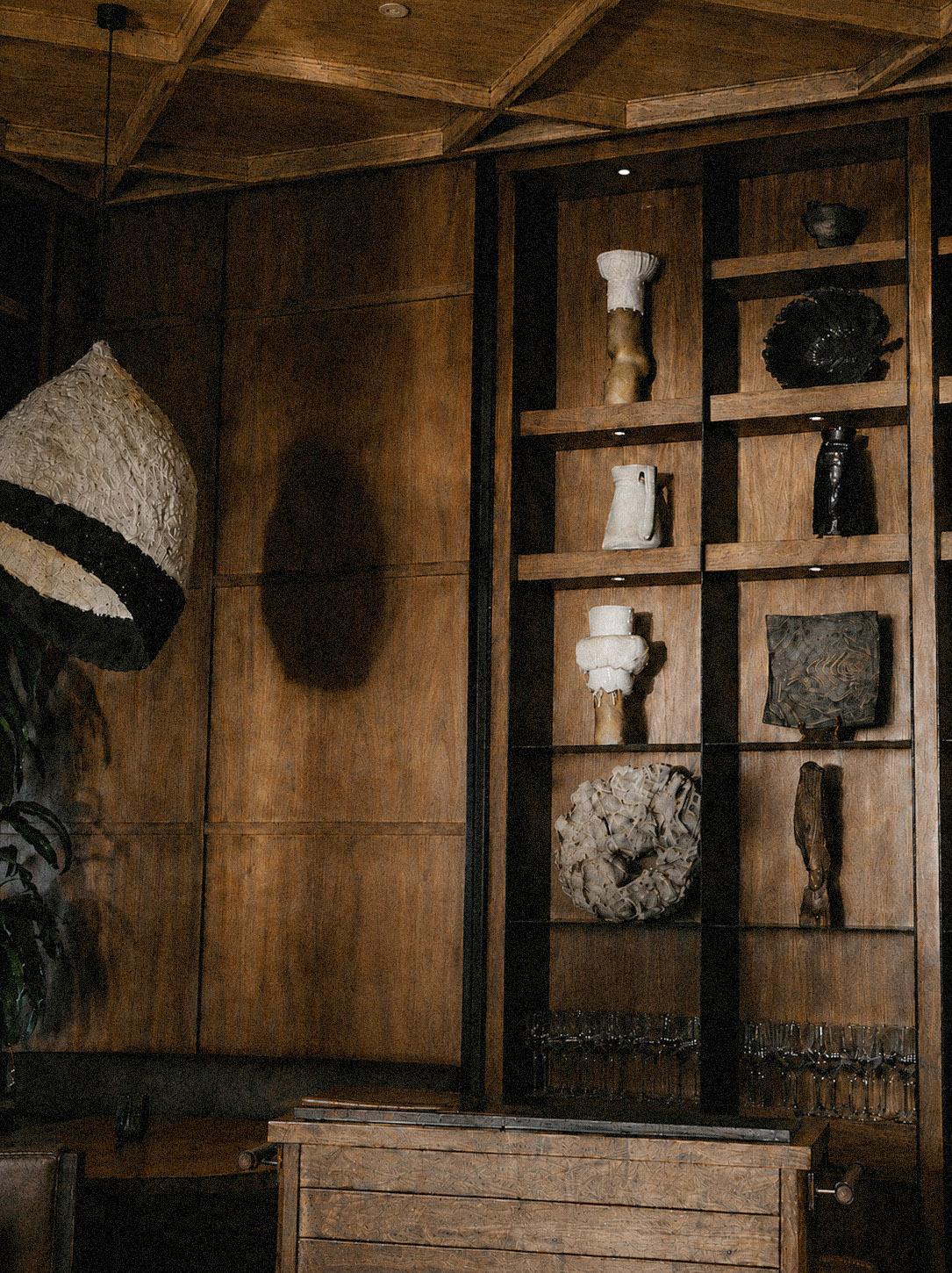 Valle host stand in Oceanside, CA, wearing a custom uniform within the restaurant’s warm, craft-driven interior.