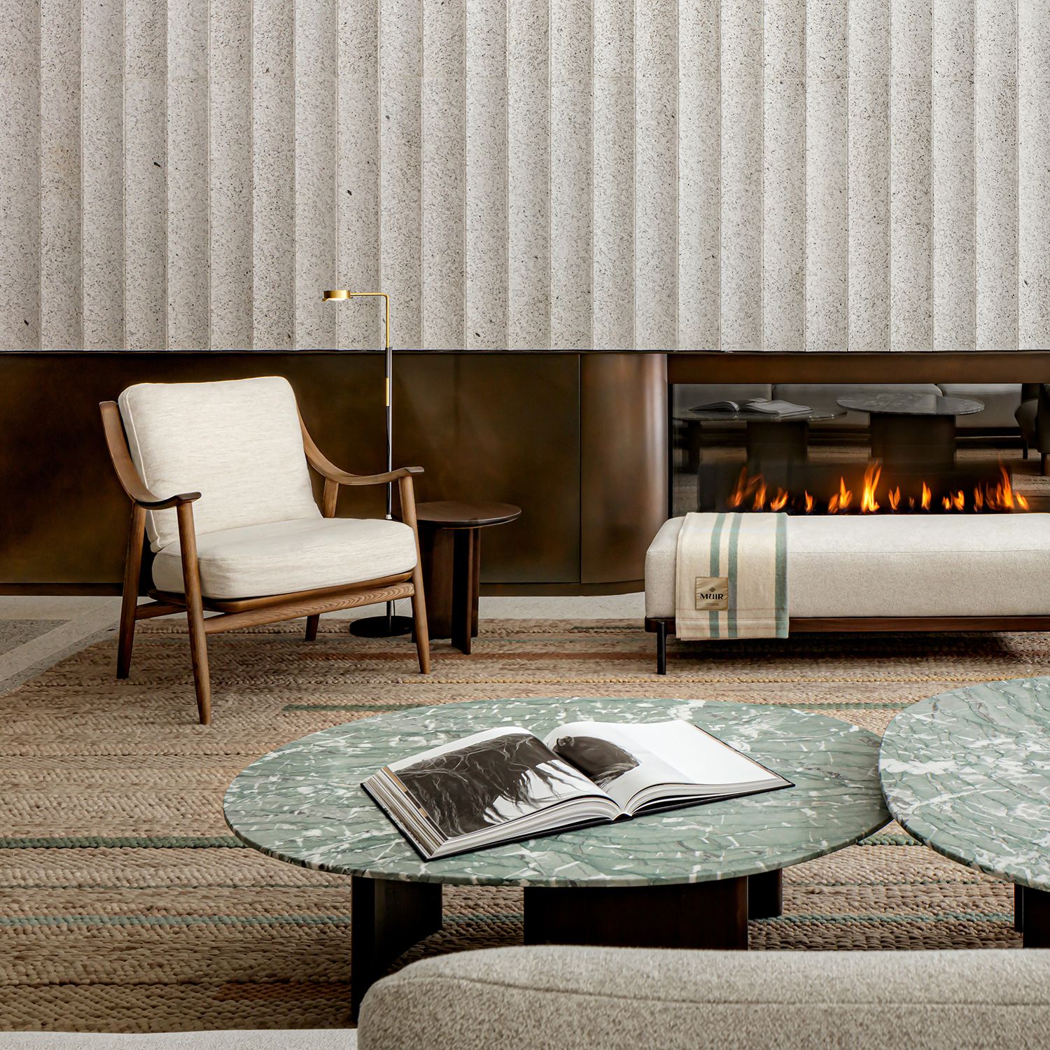 Lobby interior of Muir Halifax, a five-star luxury hotel on the Halifax waterfront. Love & War developed the hotel's brand strategy, naming, visual identity, website, and branded guest experience, creating a contemporary expression of Nova Scotia's quiet luxury through custom materials, furnishings, and refined design.