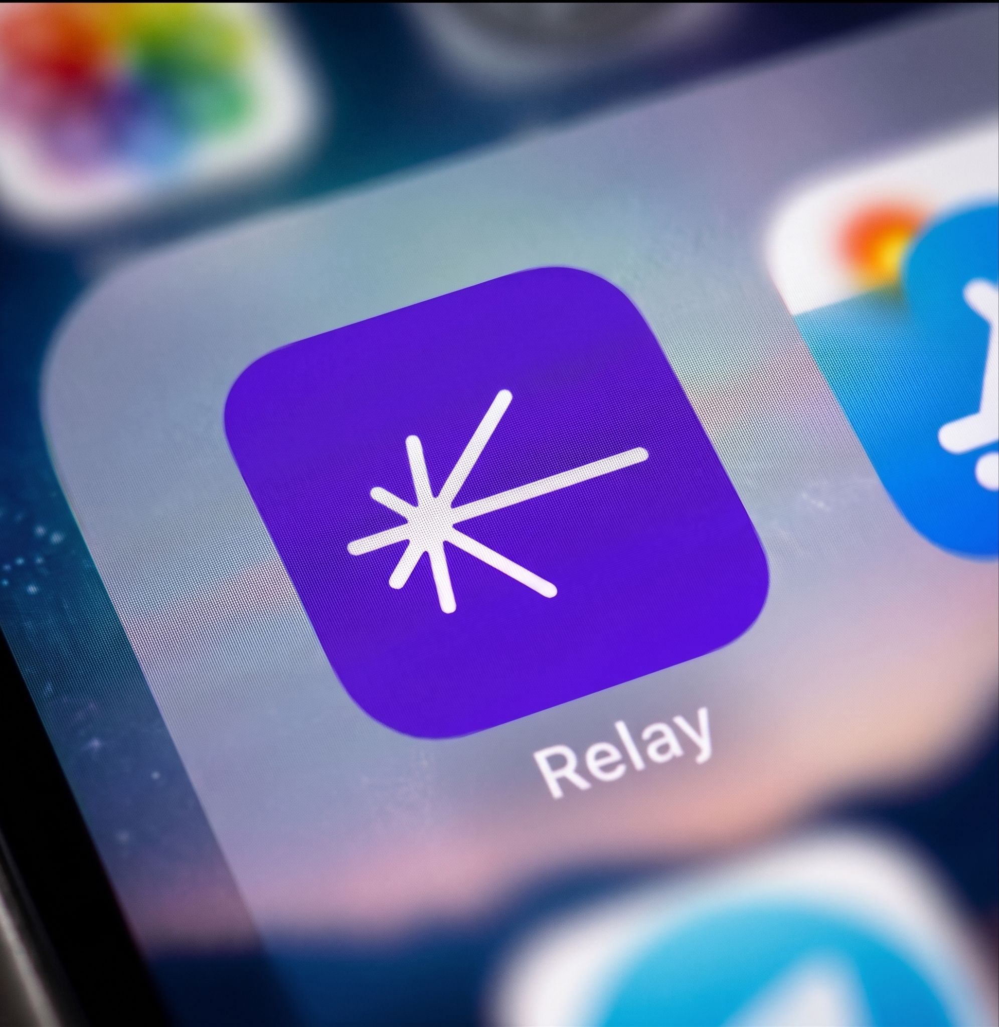 Relay mobile app icon featuring the white starburst logo on a purple background, created as part of the crypto platform brand identity by Love & War.