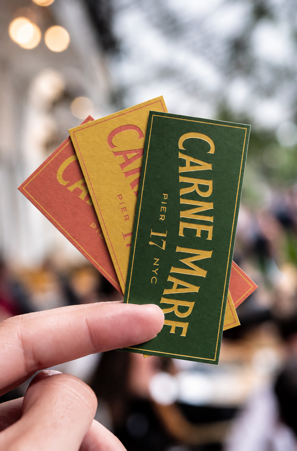 Carne Mare Pier 17 printed collateral in green, gold and red, part of the restaurant visual identity created by Love & War.