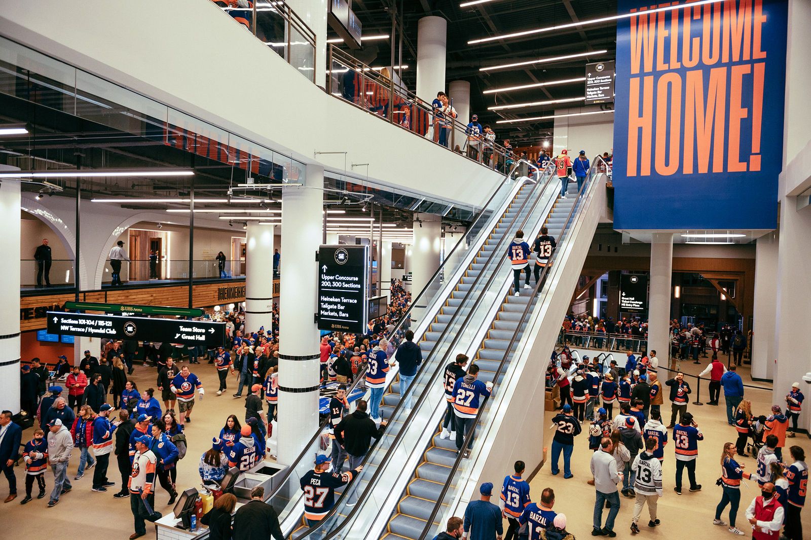 UBS Arena concourse on game day, with hospitality and branded experience developed by Love & War.