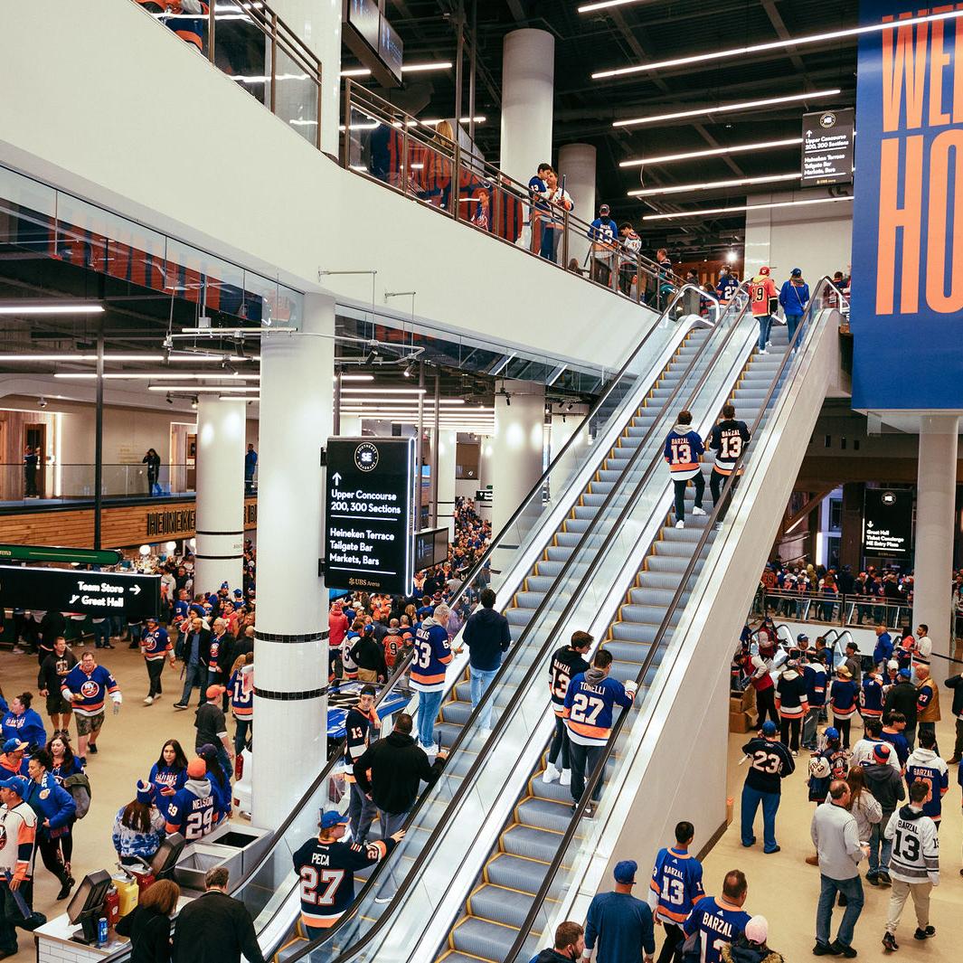 UBS Arena concourse on game day, with hospitality and branded experience developed by Love & War.