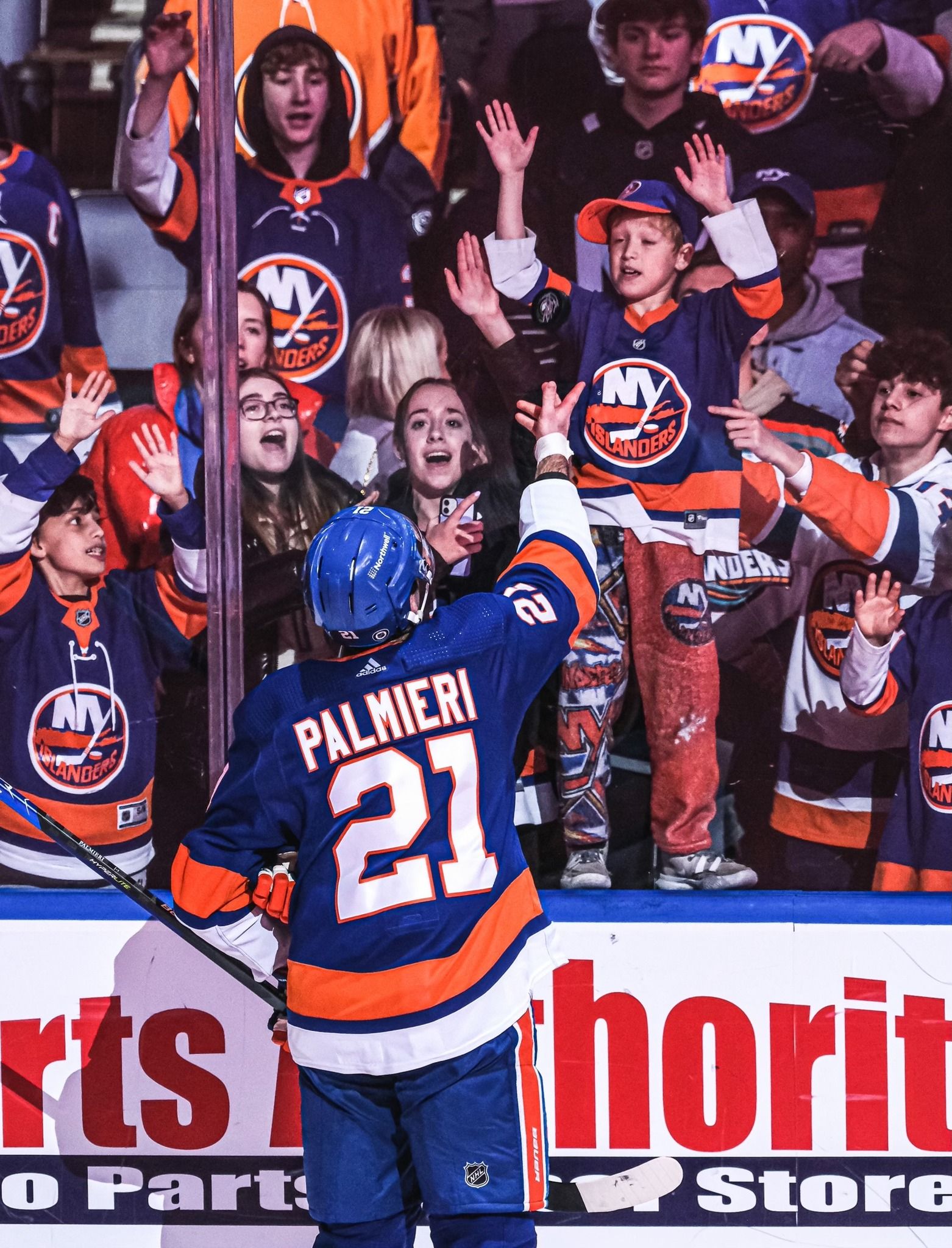 New York Islanders fans celebrating at UBS Arena, with fan experience shaped in part by Love & War.