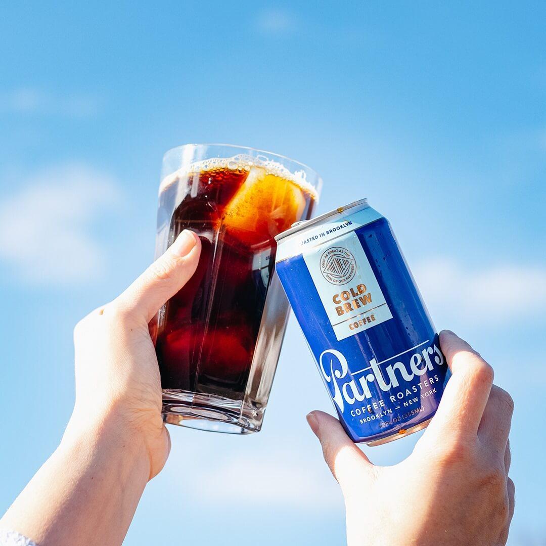 Partners Coffee cold brew can and iced coffee featuring packaging and visual identity by Love & War.