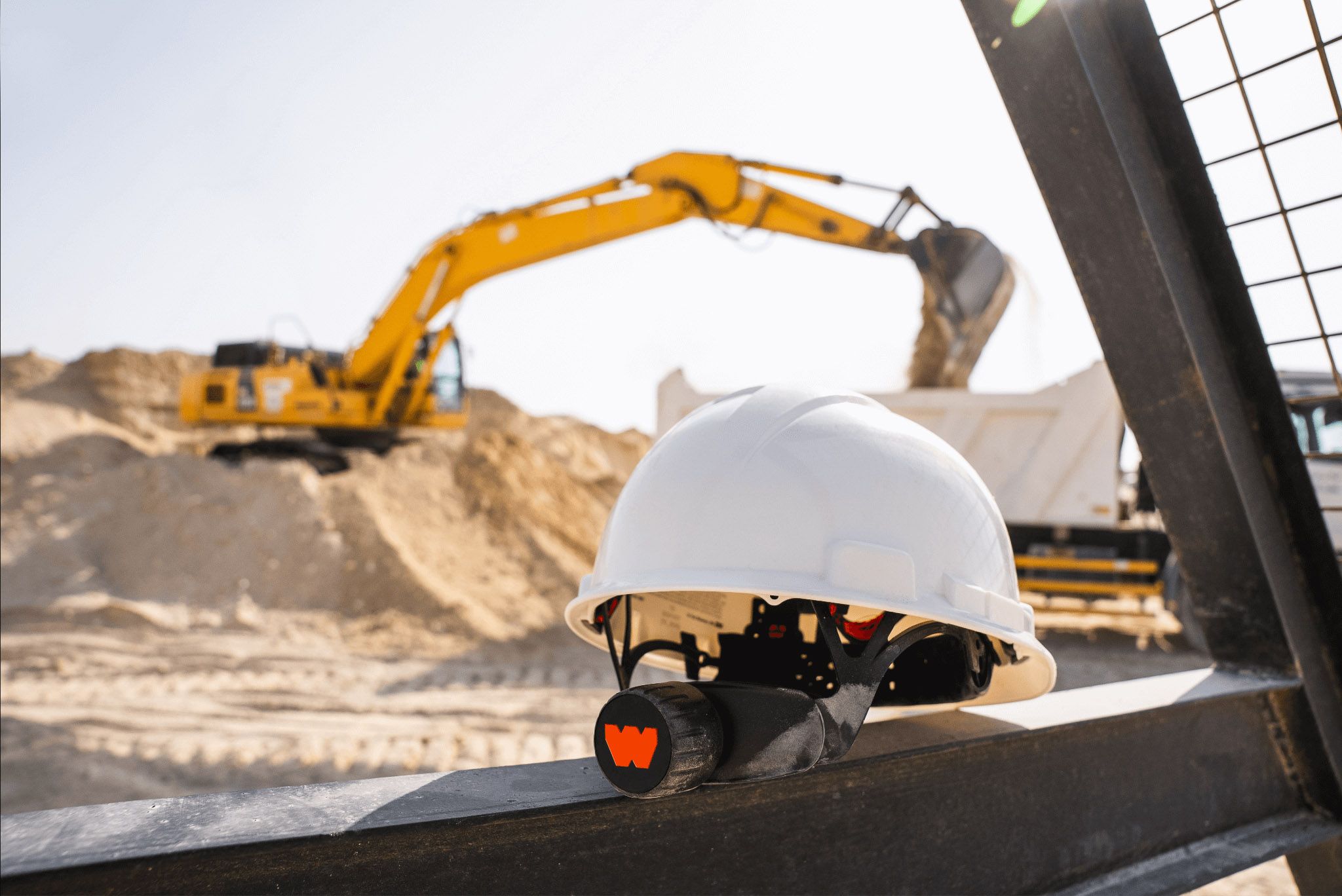 WakeCap sensing technology integrated into a construction hard hat, with brand identity by Love & War.