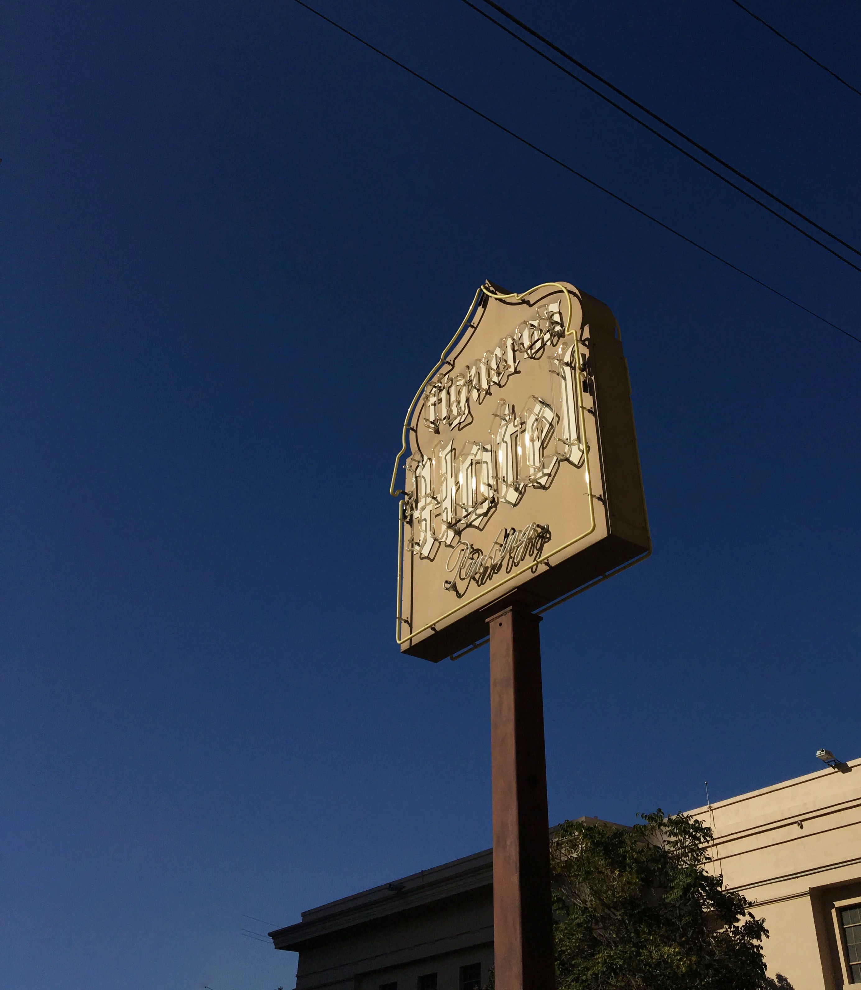 Historic Hotel Figueroa signage in Downtown Los Angeles, one of the archival design elements that inspired the hotel’s renewed visual identity. Love & War developed the brand strategy and visual identity for Hotel Figueroa, drawing from original signage, historic logos, typography, architecture and archival materials to create a contemporary hospitality brand rooted in the Los Angeles hotel’s distinctive history.