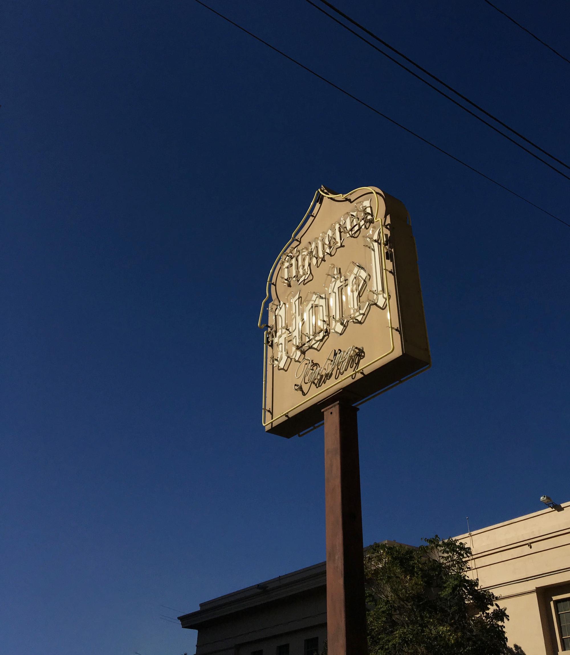 Historic Hotel Figueroa signage in Downtown Los Angeles, one of the archival design elements that inspired the hotel’s renewed visual identity. Love & War developed the brand strategy and visual identity for Hotel Figueroa, drawing from original signage, historic logos, typography, architecture and archival materials to create a contemporary hospitality brand rooted in the Los Angeles hotel’s distinctive history.