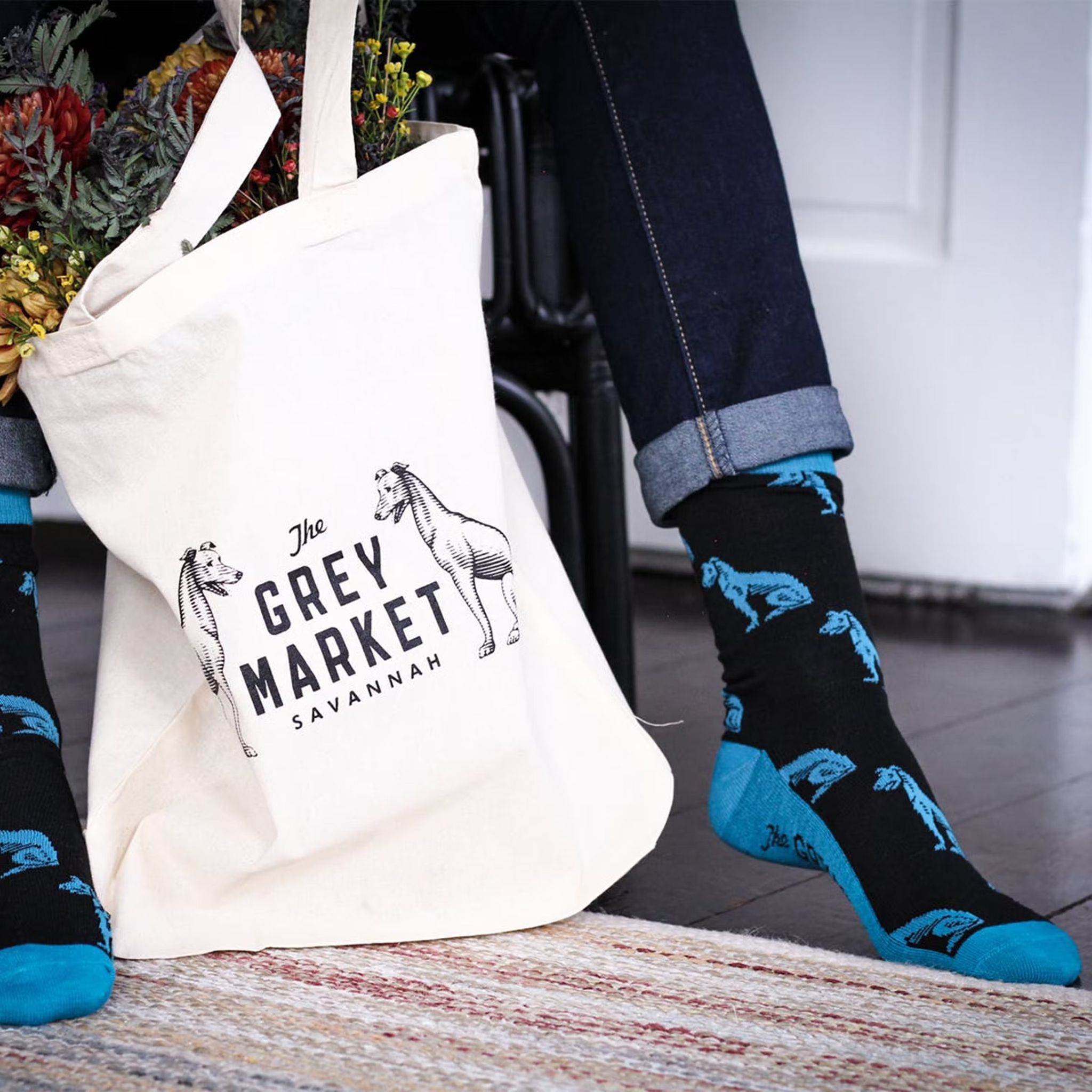 The Grey Market tote and custom socks in Savannah, GA, featuring branded merchandise designed by Love & War.