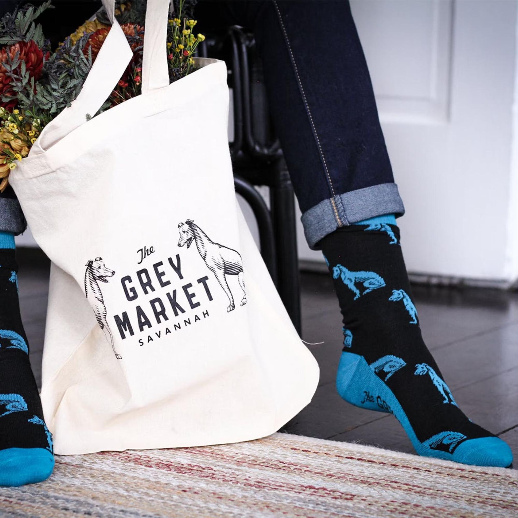 The Grey Market tote and custom socks in Savannah, GA, featuring branded merchandise designed by Love & War.
