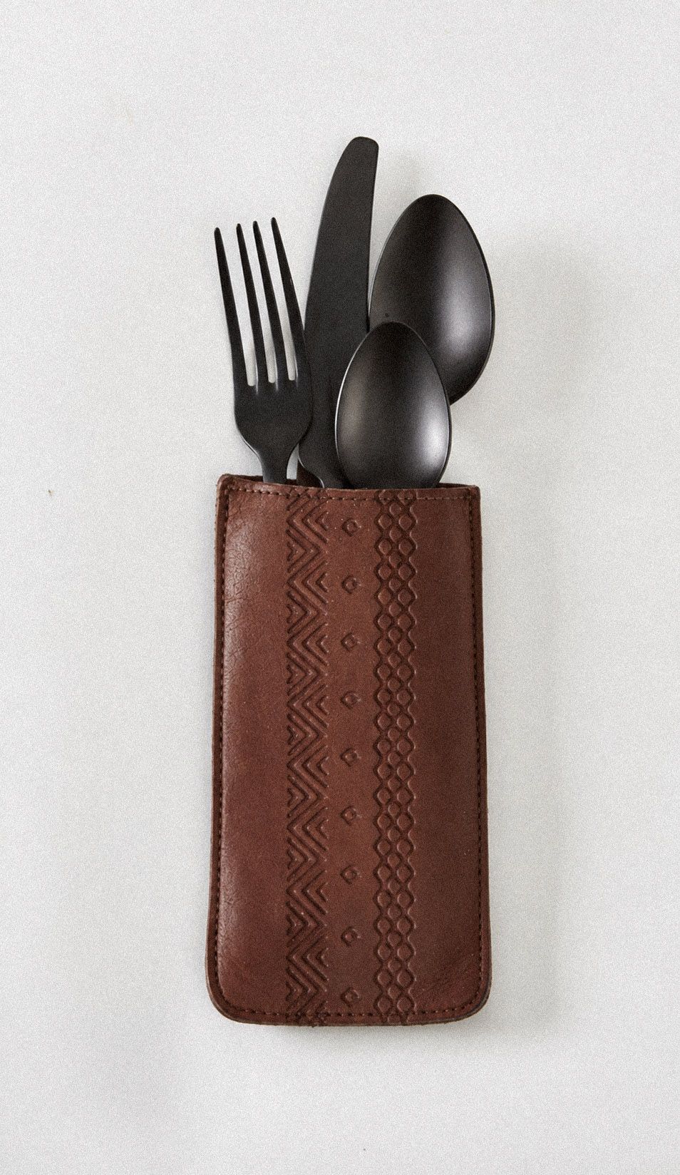 Valle custom leather flatware holder featuring patterns inspired by Oaxacan craft, part of the identity by Love & War.