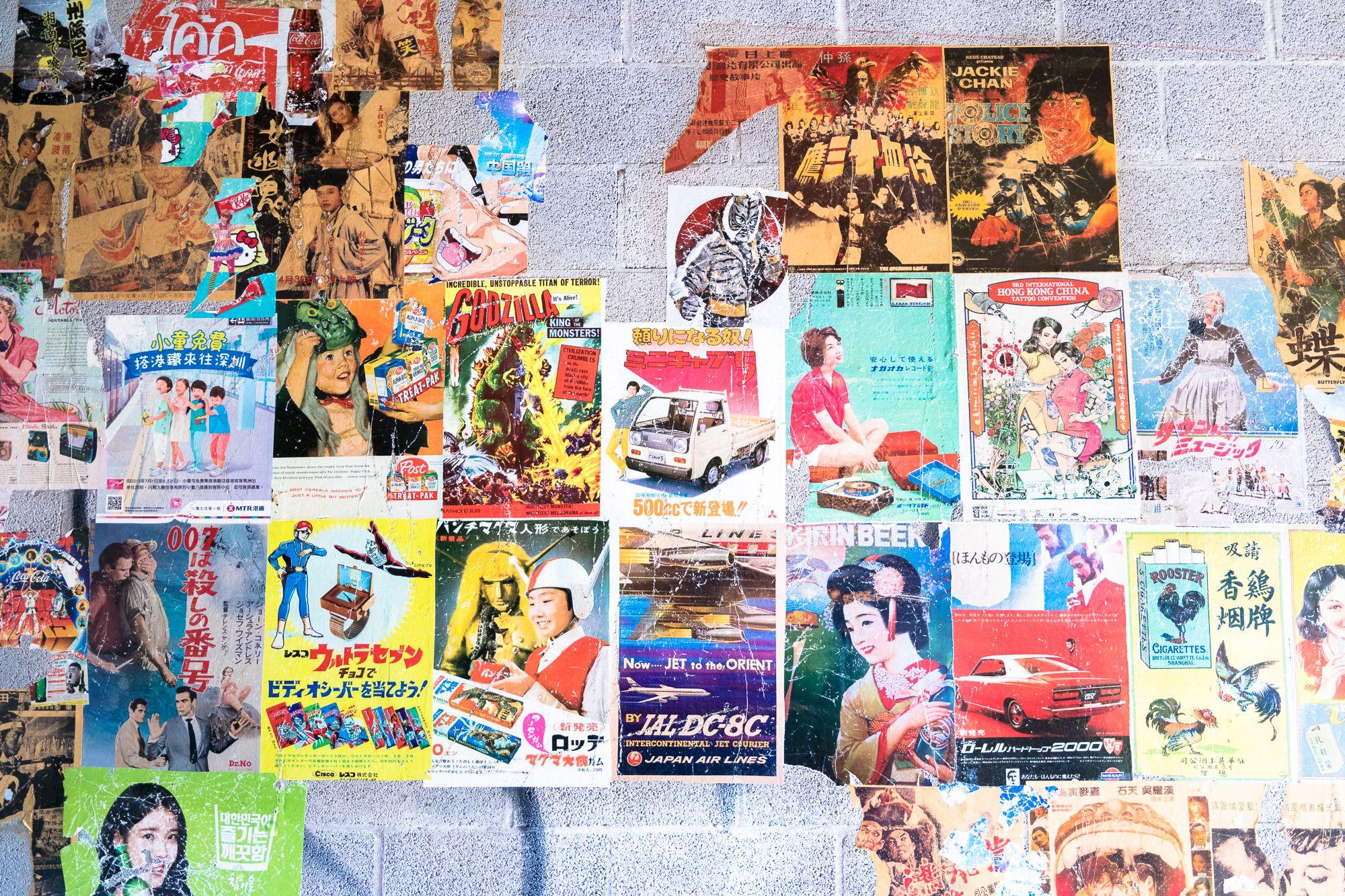 Layered vintage Asian posters and graphic ephemera used throughout 1-800-Lucky, reflecting the eclectic visual language of the brand experience.