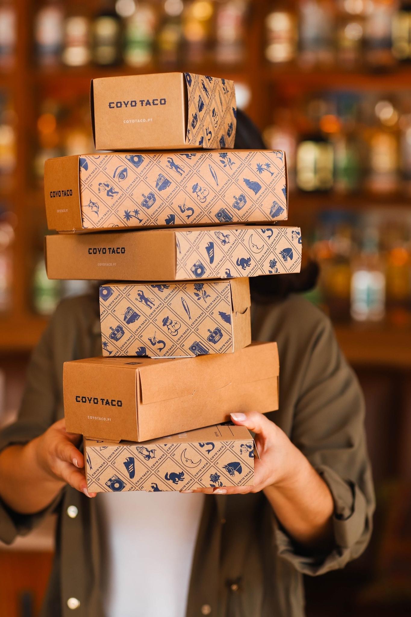 Coyo Taco takeout boxes featuring custom packaging and visual identity designed by Love & War.