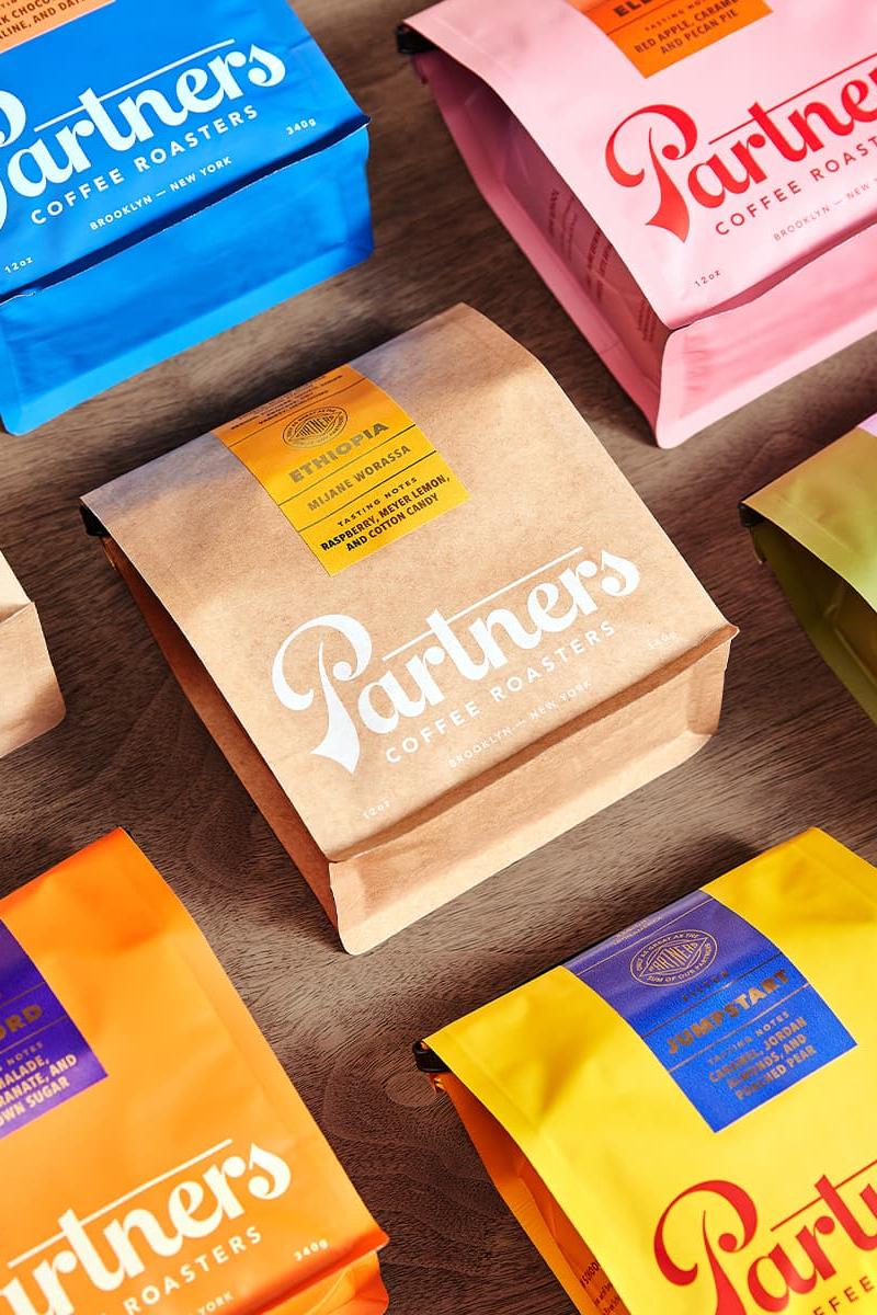 Partners Coffee packaging system featuring the colorful brand identity and packaging designed by Love & War.