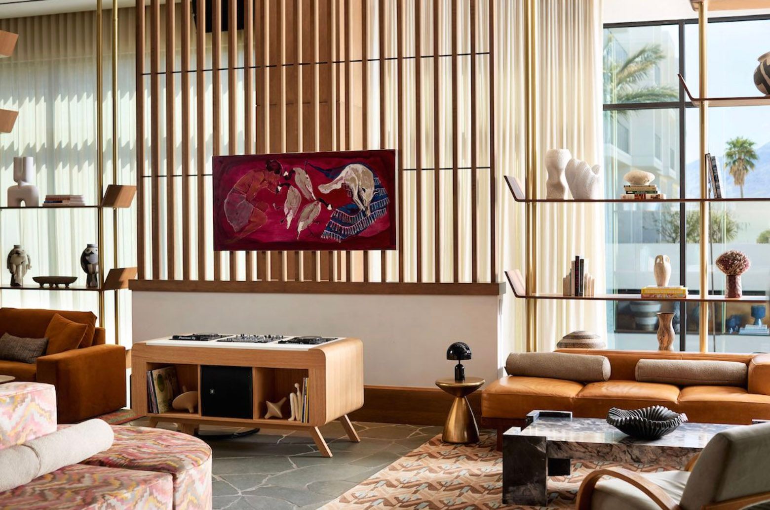 Interior of Thompson Palm Springs, home to Lola Rose Grand Mezze, with warm modernist design and views of the Palm Springs landscape